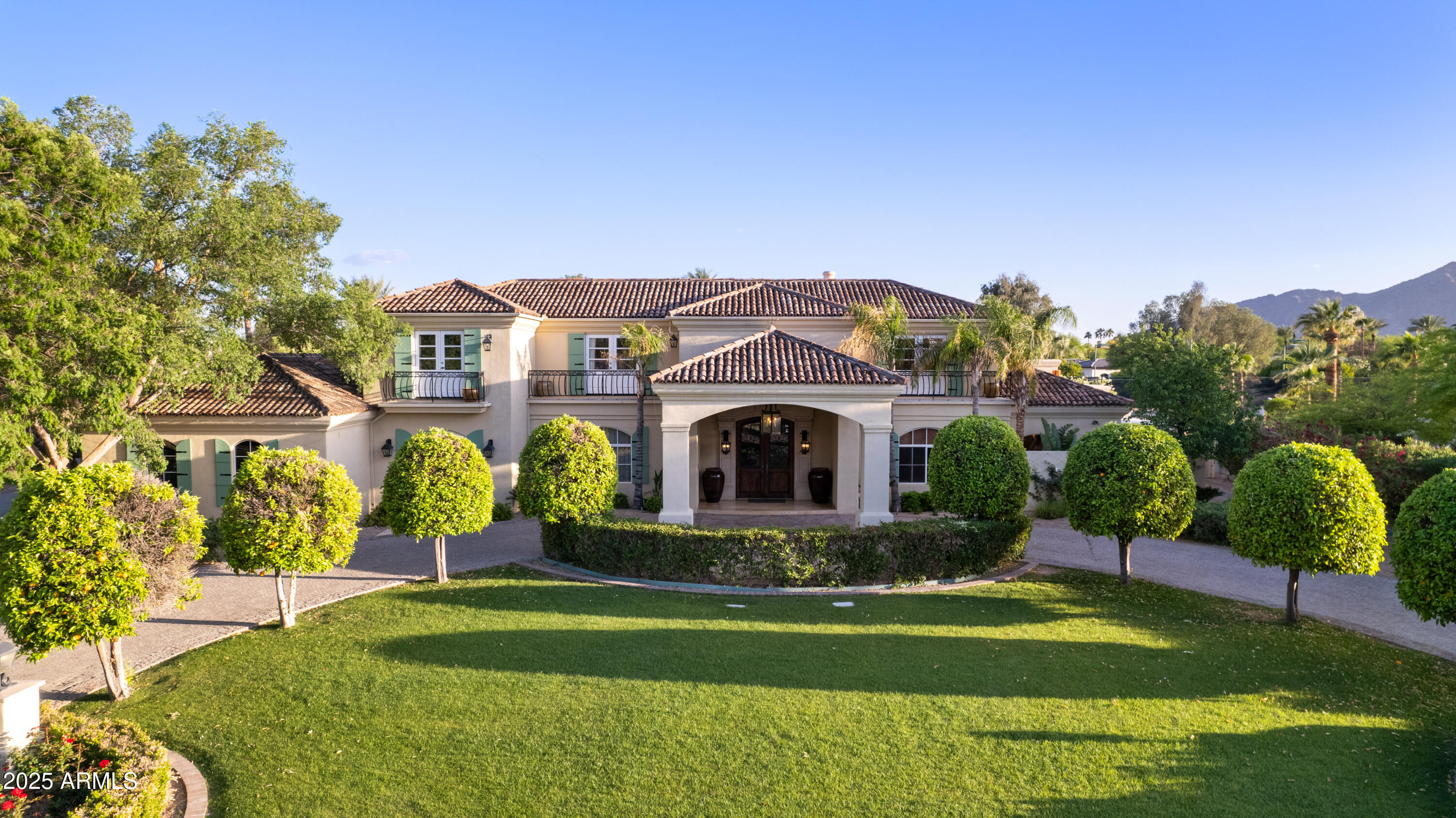 Discover resort-style elegance in this extraordinary Paradise Valley estate by Cal Christiansen featuring four ensuite bedrooms and separate guest quarters—perfectly suited as an exercise studio complete with a dry sauna and full bathroom. A stunning marble fireplace anchors the grand living area, while the expansive media room dazzles with a fibre optic star-lit ceiling, built-in home theater, surround sound, saltwater aquarium, and mini bar with dual-zone wine coolers.

Step outside into your private oasis, complete with a heated pool, spa, sunken tennis and pickleball court with basketball hoop, and a fully equipped ramada for al fresco dining. A serene koi pond, dedicated children's play area, and thoughtful design details throughout make this home both luxurious and livable