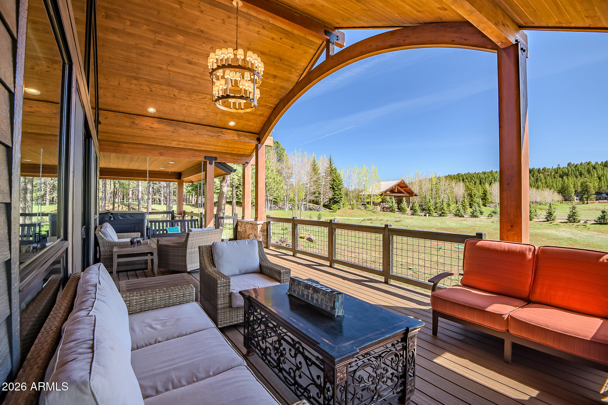 The homesite strikes a rare balance-mature Ponderosa pines for privacy, paired with open meadow views for light and depth. In spring, the setting comes alive with fresh green growth, blooming trees, and active wildlife just beyond your windows. For buyers seeking a Northern Arizona retreat that feels both grounded and elevated--whether as a primary home or second escape--this property delivers a clean, livable approach to luxury just minutes from Flagstaff. This single-level design offers 3,094 sq ft with 4 bedrooms, 3 bathrooms, and 2 bonus/bunk rooms--ideal for hosting extended family, accommodating guests, or creating flexible spaces for work and recreation. The open-concept living area is anchored by large windows that keep the landscape present from every angle. Positioned on 2.39 acres in gated Foxboro Ranch Estates and backing the Coconino National Forest, 405 E Foxboro Rd is built for a lifestyle centered around space, privacy, and connection to the outdoors. Days naturally unfold here--coffee on the deck as the meadow opens in front of you, quiet afternoons under the pines, and evenings in the spa with nothing but fresh mountain air and stars overhead.