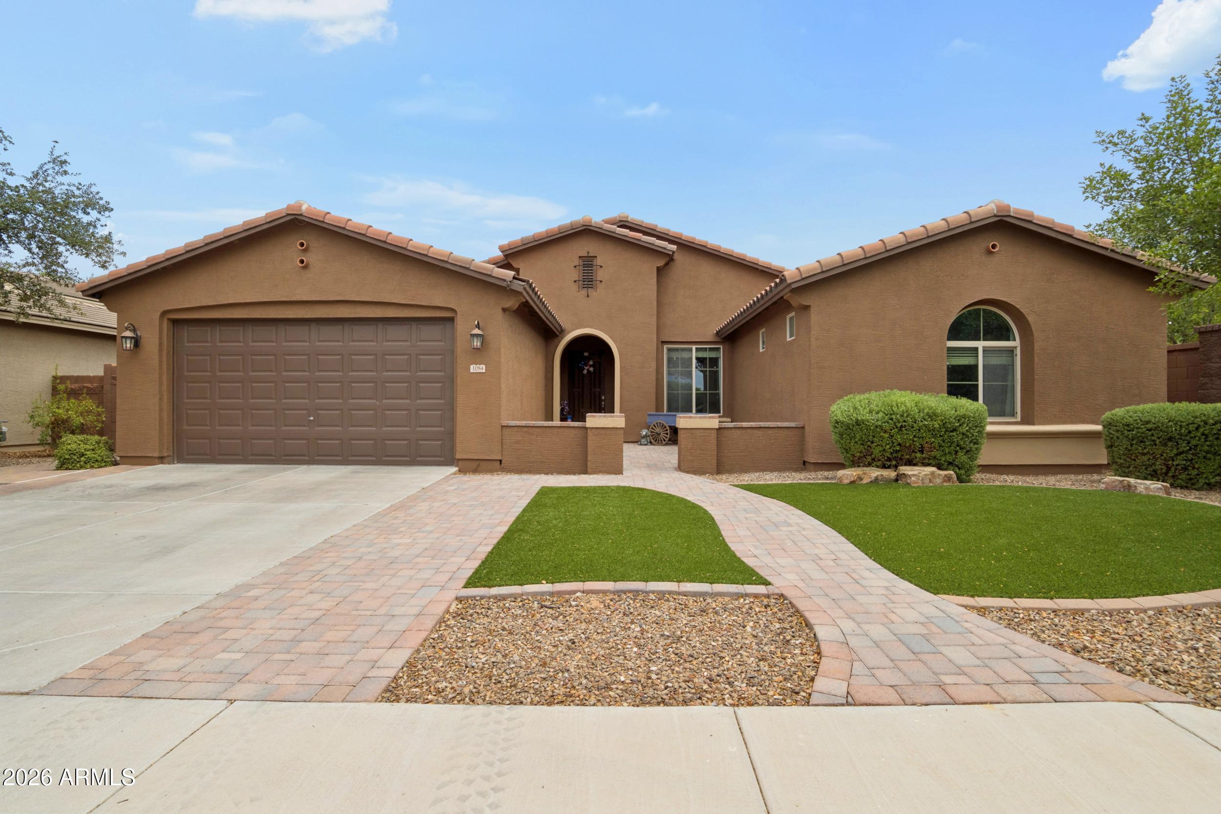 One of the LARGEST single story homes at a great price! 4 LARGE bedrooms with an office, 2.5 bathrooms, a 3-car tandem garage, all thoughtfully designed for comfortable living and effortless entertaining. The chef-inspired kitchen is the heart of the home, featuring a large center island, gas cooktop, wall oven, abundant cabinetry, and an oversized walk-in pantry. The desirable split floor plan provides privacy for the expansive primary suite, while the secondary bedrooms each include their own walk-in closet. The dedicated office, complete with a custom barn door. The showpiece of the backyard is the heated and chilled pool, allowing you to enjoy a refreshing swim during the summers and comfortable water temperatures through the cooler months. the perfect blend of luxury and comfort!
