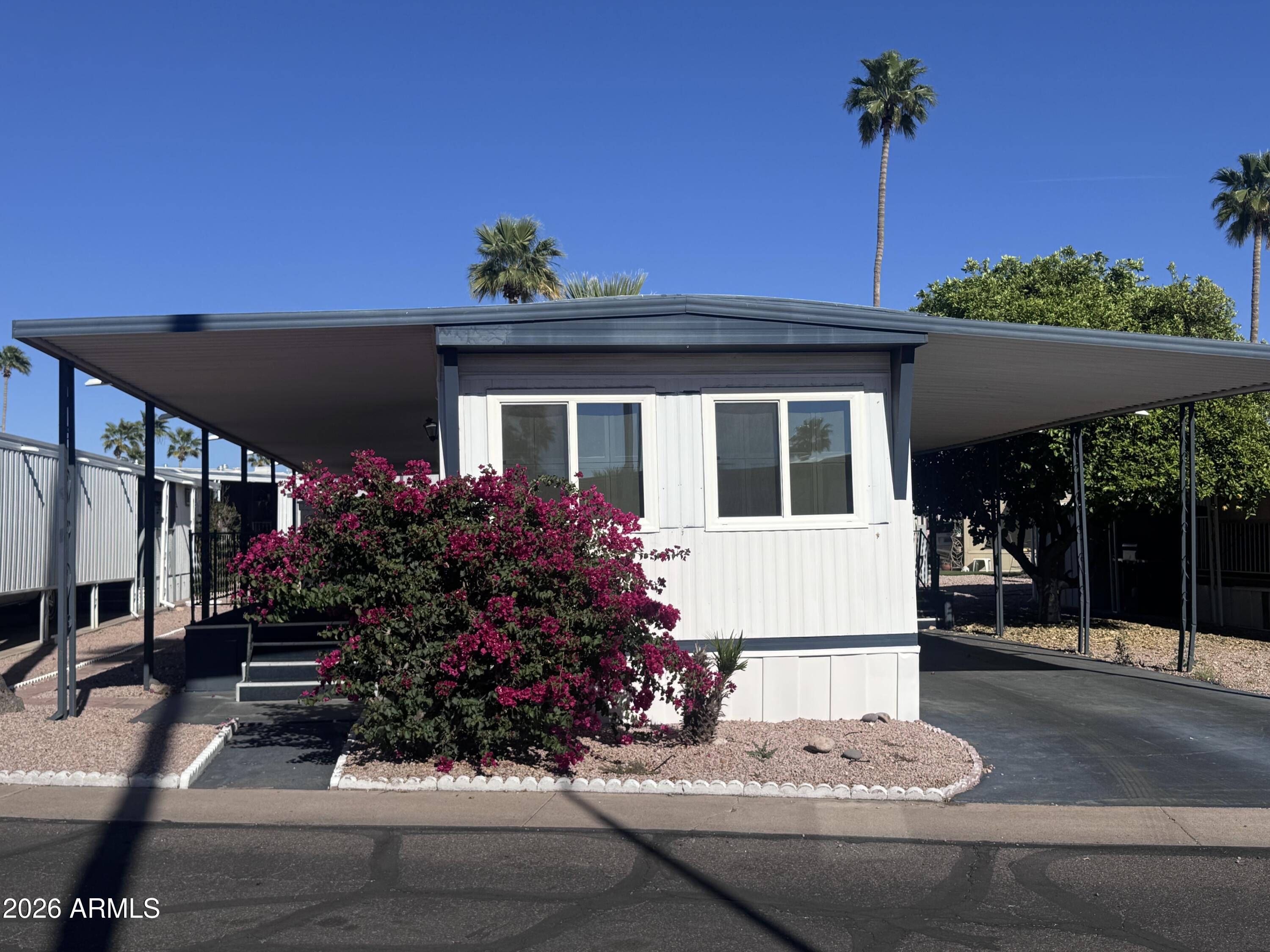 Experience comfortable living at its finest with this affordable and furnished three bedroom home! This home has undergone significant updates in 2021 to include dual-pane windows, new AC, a hot water heater, and roof. The kitchen includes a convenient pantry and all appliances. Situated in a lively adult community, residents can enjoy resort style amenities like a heated pool and spa, dog park, club house with billiards, laundry facilities, library, and a packed calendar of social events. This home combines value, comfort, and community!