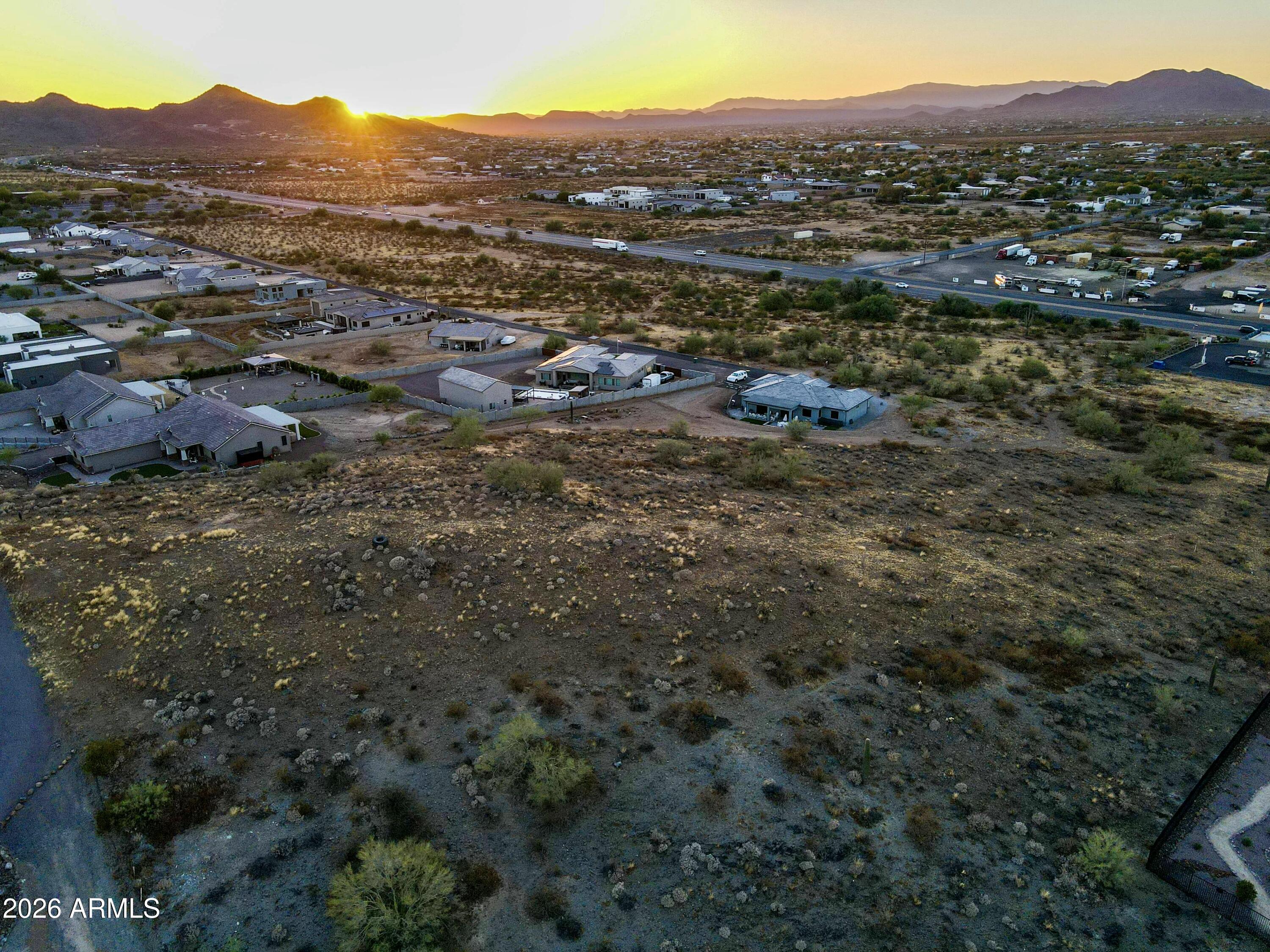 Perched atop one of Desert Hills' most coveted elevations, this 2-acre homesite delivers the kind of panoramic views that stop people in their tracks -- sweeping city lights, mountain silhouettes, and endless Sonoran Desert horizon in every direction. This is a blank canvas for a custom estate, positioned in a quiet, low-density enclave just minutes from Carefree Highway.
No HOA. No subdivision restrictions. Just raw desert land and unmatched privacy.