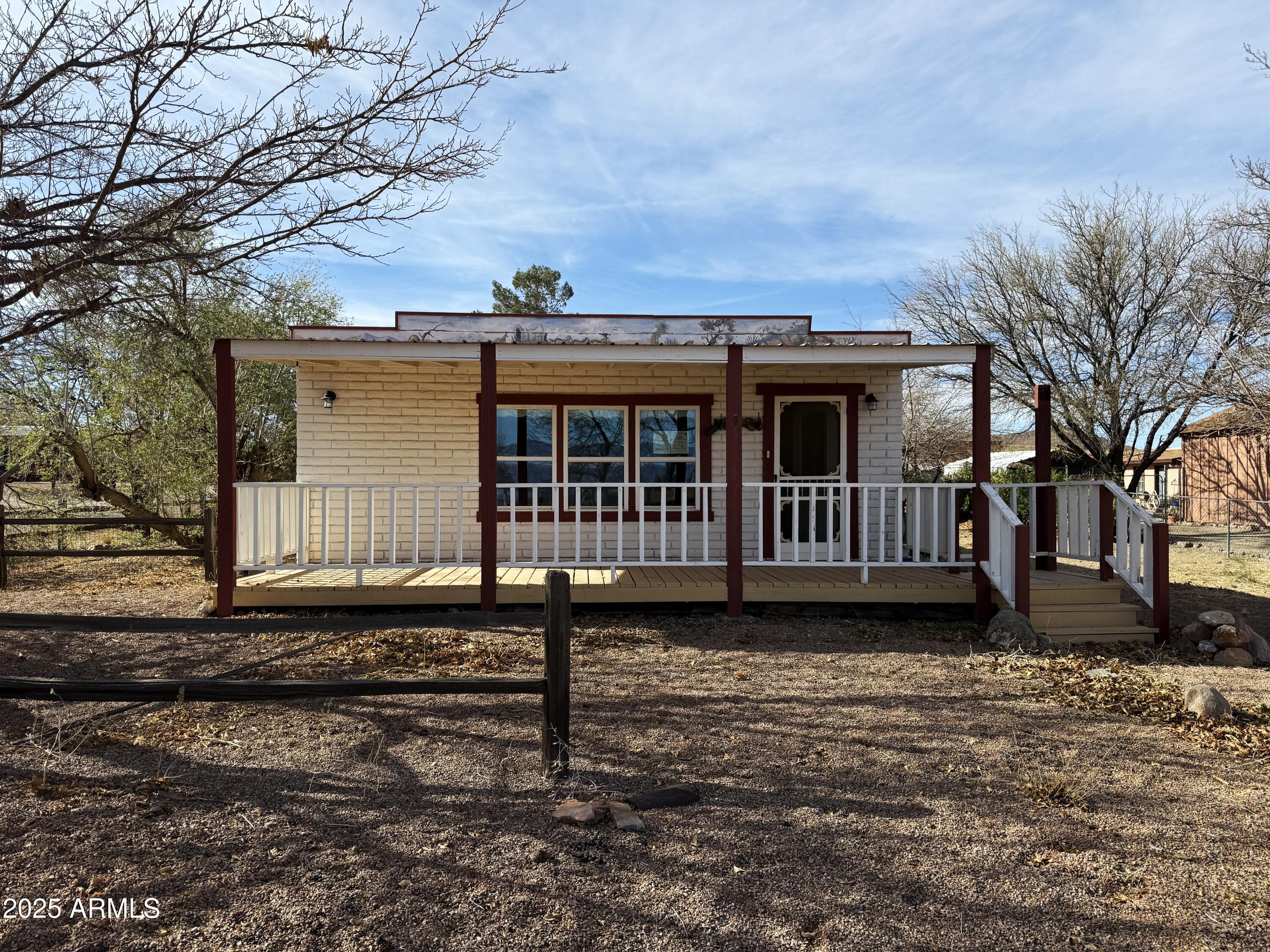 This home is ready for new owners. This property is almost a 1/4 acre of level property. There is RV and covered parking as well as 2 small sheds. The property is also fully fenced. Inside you will find a HUGE great room with room for living and dining. There are 2 bedroom and a really cute kitchen. The bath is in really good condition too. If that is not enough, there is a large family room in the back as well as a good sized laundry room. Do not let this one pass you by.