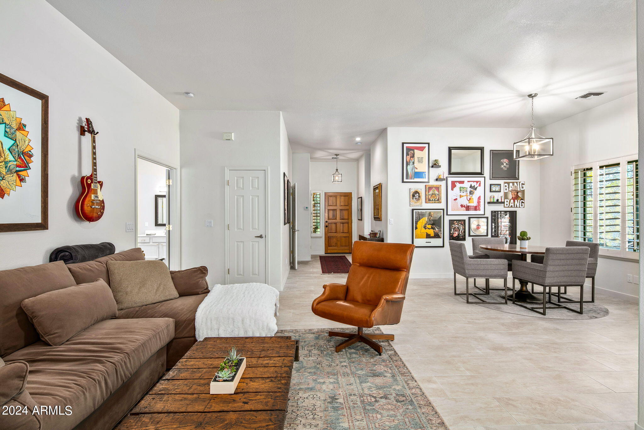 Welcome to the perfect lock-and-leave home. This end unit is outfitted with stainless steel appliances, new flooring, new roof, and new AC. The kitchen features beautiful granite countertops, newly painted kitchen cabinets with soft-close hardware, and a new refrigerator. The spacious primary bedroom offers abundant natural light and a large walk-in closet. Main and guest bathroom cabinetry was repainted in December 2021. The attached two-car garage includes built-in cabinets for additional storage and a new water softener system. The covered back patio opens to a small backyard with a new gas line and BBQ, as well as access to the footpath leading to the community pool. Fine dining and shopping are just a short five-minute walk