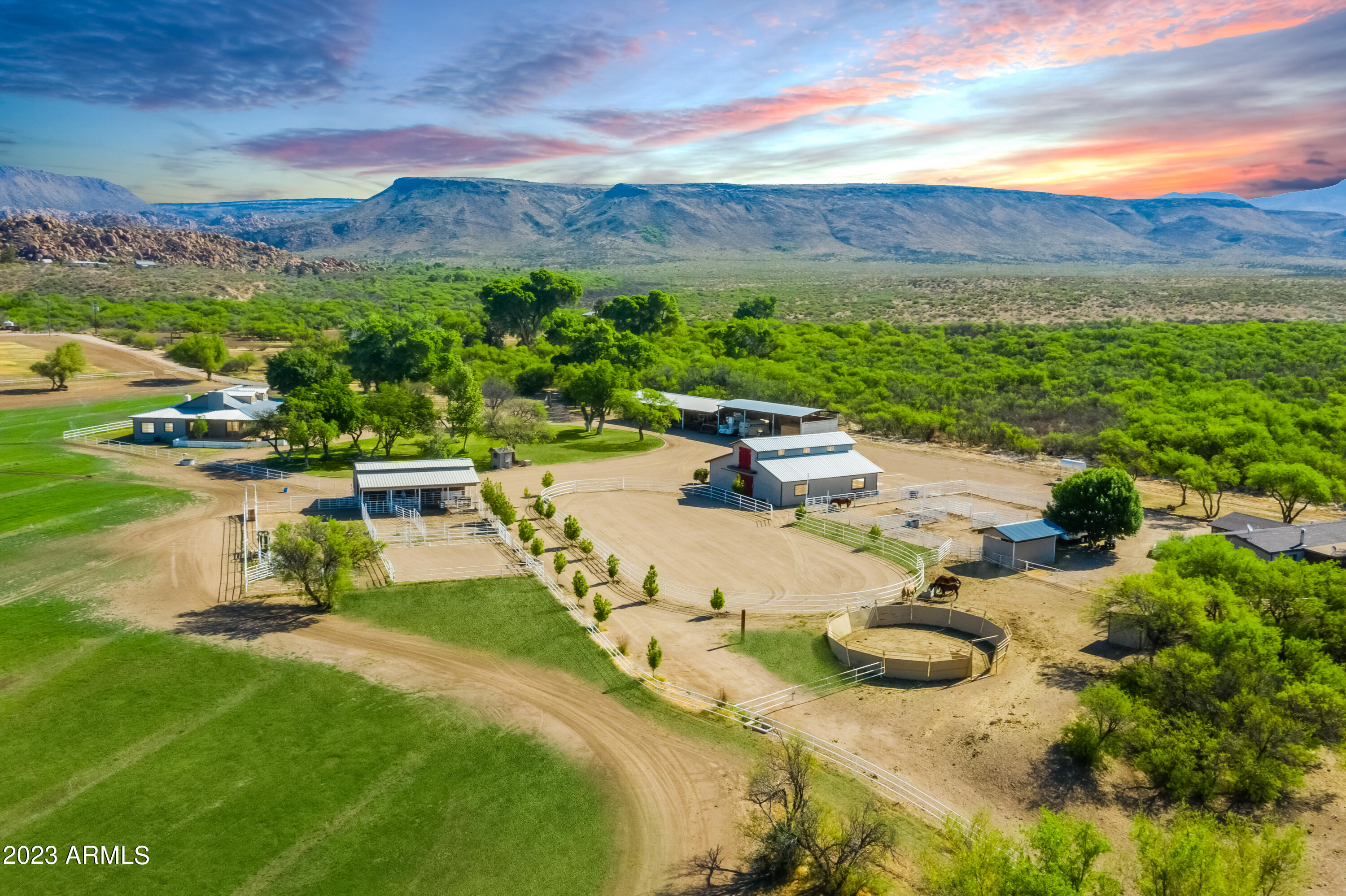 Incredible opportunity to own a part of American History. This 341 acre property has a peaceful creek running through it & features two 20 acre grass pastures & multiple wells that pump 400/gpm providing abundant amounts of water. Main barn includes a large workshop & vet room. Arena, round pen & custom corral system make this the ideal place to bring your horses. There are 3 homes on this property, the main home is absolutely gorgeous, tall/vaulted ceilings w/beautiful views of the pastures & mountains. Miles of trail riding & endless views with plenty to discover. Find ancient petroglyphs, hidden arrowheads, and more, as this is an Ancient Archaeological Site.  Room for up to 50 head of cattle & your prized horses. Ideal family or corporate retreat or 1031 exchange. Please see video.