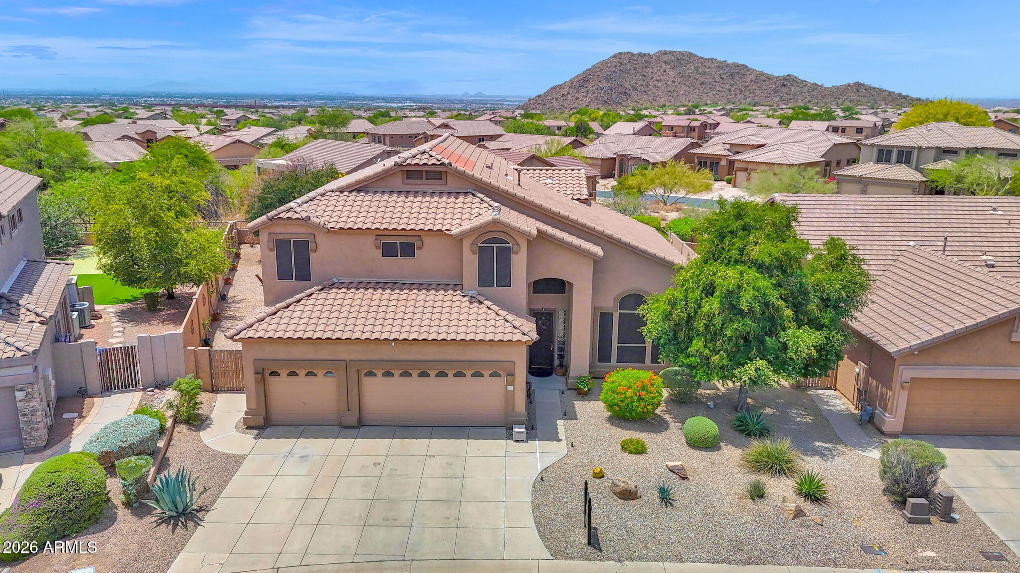 Move-in ready and beautifully prepared. This sought-after floor plan has been meticulously maintained and thoughtfully upgraded to impress even the most discerning buyer. Situated on an oversized yet private lot, this home offers room to relax, entertain, and grow. Enjoy summer days by the pool, gather beneath mature shade trees, or take in Arizona sunsets around the firepit. Inside, you'll find light, bright living spaces, neutral finishes, stylish selections, and brand-new carpet. A full bedroom and bathroom downstairs provide ideal space for guests, multigenerational living, or entertaining family and friends. Upstairs, the 5th bedroom is currently open to the primary suite, creating a perfect office, sitting room, nursery, or private retreat--with the option to enclose it with one wall for a true 5th bedroom. Located in a desirable golf community with A+ amenities, Grade-A schools, hiking and biking trails, pickleball, pools, parks, and year-round recreation. Just minutes from Scottsdale, Sky Harbor, and Falcon Field--this home delivers lifestyle, location, and comfort all in one.