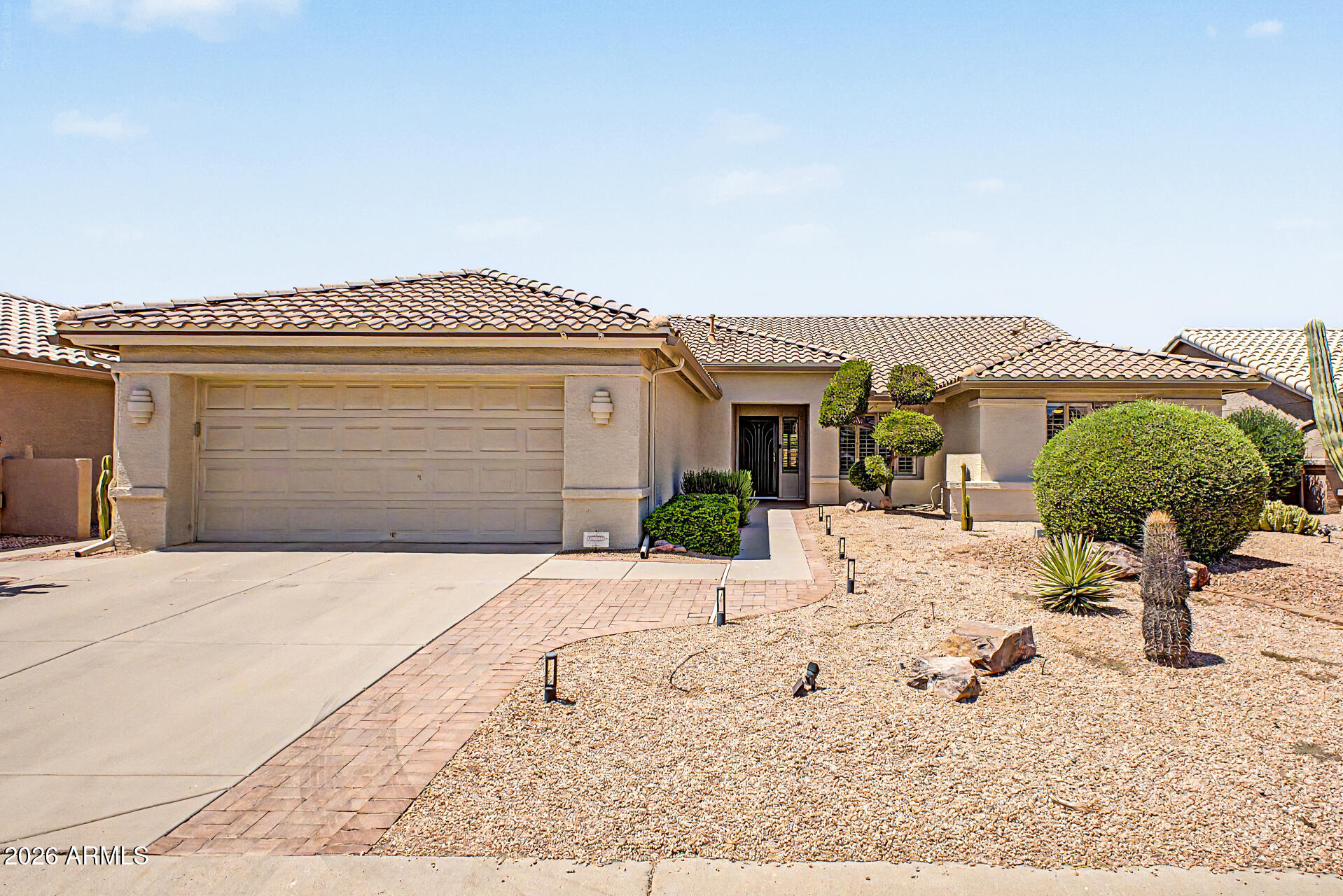 Beautifully maintained and ready to enjoy from day one, this Trova floor plan is in the gated adult community of Oakwood at Sun Lakes! The open layout with 2 bedrooms, 2 baths + DEN features engineered hardwood floors in the great room, 5-inch baseboards, plantation shutters and remote patio door blinds. The kitchen offers beautiful maple cabinetry with pull-out shelves & abundant storage, an eat-up island, granite countertops and stainless appliances. The primary bath is updated with a walk-in shower and a large custom closet. Laundry room has extra storage and a sink. Extended garage includes built-in cabinets. Roof (2024), HVAC (2020), Water Heater & Water Softener (2025). Peaceful, private backyard with a large, covered patio and fruit trees. Come enjoy all that Sun Lakes has to offer!
