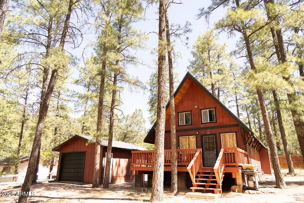 Welcome to your mountain retreat in the heart of Strawberry! Nestled among the tall pines, this beautifully updated A-FRAME cabin offers the perfect blend of cozy cabin charm and modern comfort. Featuring a newly upgraded kitchen with stylish finishes and updated cabinetry, this home is move-in ready and designed for easy mountain living. Inside, you'll find updated flooring throughout, fresh interior paint, and a beautifully remodeled bathroom complete with dual sinks for added convenience and functionality. The inviting layout creates a warm and comfortable atmosphere, perfect for relaxing weekends or full-time living in the cool mountain air. Step outside and enjoy the large fenced-in yard, offering plenty of space for pets,  more... entertaining, gardening, or simply relaxing and taking in the peaceful mountain surroundings. Surrounded by nature, abundant wildlife, and the serenity that makes Strawberry such a sought-after destination, this property truly captures the beauty of mountain living. Whether you're looking for a weekend getaway, vacation rental opportunity, or your forever home in the pines, this property is ready to impress.