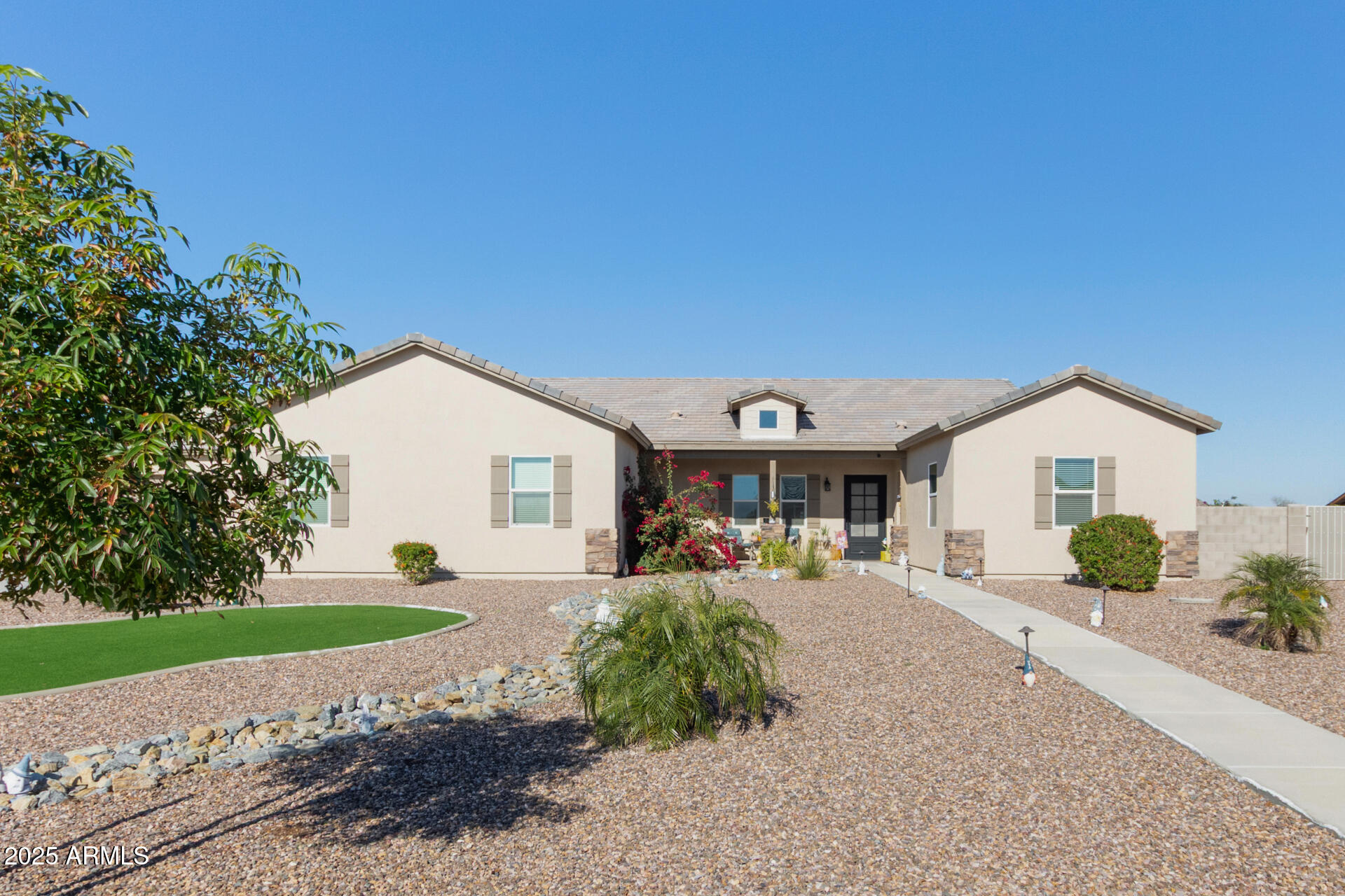 Rare custom home with private casita on 1 acre lot with fantastic mountain views! Main house boasts 2 primary suites, and an additional bedroom. This 4-bedroom gem, complete with a 4-car garage and RV gate, radiates style and comfort at every turn. Discover a spacious open floor plan designed to maximize space and create a seamless flow for entertaining. Gourmet kitchen displays recessed lighting, abundant cabinetry adorned with crown moulding, tile backsplash, a walk-in pantry, stainless steel appliances, granite counters, a prep island with a breakfast bar, and a butler's service area. Large main retreat impresses with direct outdoor access, an ensuite with dual sinks, and a walk-in closet.  Expansive backyard provides a covered patio, play area, and a fire pit