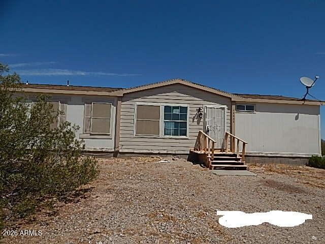 Priced to sell, Roomy dourblewide mfg home in need of some TLC. Make this your dream home with your imagnination and elbow grease. A little over 2.5 acres that includes a well and septic. Value is in the land with its improvements. This is a great opportunity to acquire 2.5 private acres in Tonopah. Property is sold ''as-is, where-is'' with no reps or warranties. Seller will provide no CLUES or SPDS rpts. Seller will not pay for any fees associated wih HOA transfer. Buyer may choose own title company. Buyer will be responsible for all title and escrow fees. This property may qualify for Seller Financing. (Vendee)