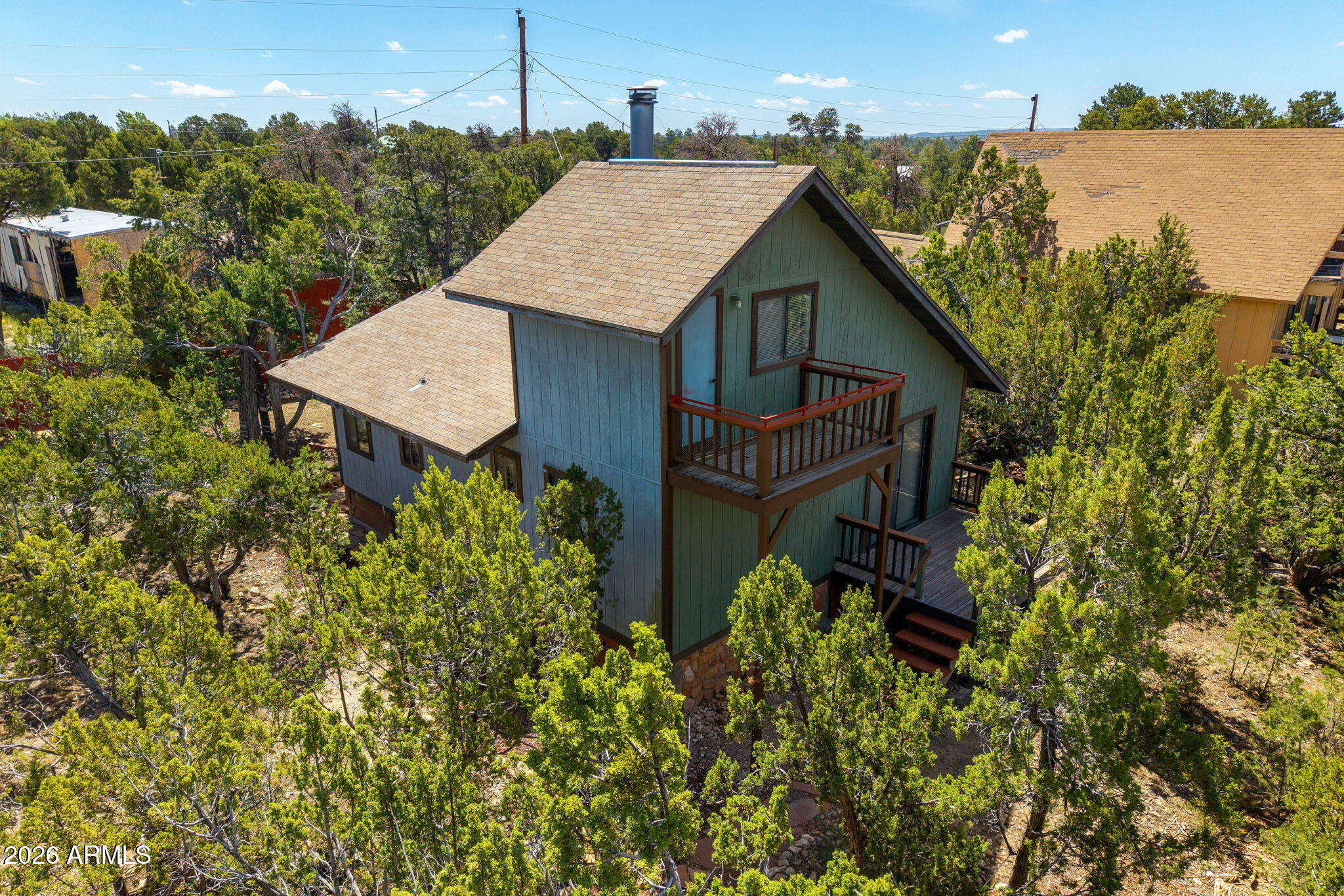Charming mountain retreat surrounded by towering trees for added privacy & a peaceful setting! This cozy 1-bedroom home features a versatile den that can easily serve as a 2nd bedroom, office, or hobby space. Enjoy stunning & panoramic views from either front deck or balcony!
Inside, don;t let the size fool you, the inviting living area showcases a stunning floor-to-ceiling flagstone fireplace with a woodburning insert and blower for warmth and comfort, along with a beautiful tongue-&-groove accent wall that adds rustic charm. The functional mud room offers extra storage & convenience for mountain living.
Outside, the property includes a partial wire fence & a wood privacy fence in the backyard, creating a great space for pets, entertaining, or simply enjoying the outdoors in seclusion.