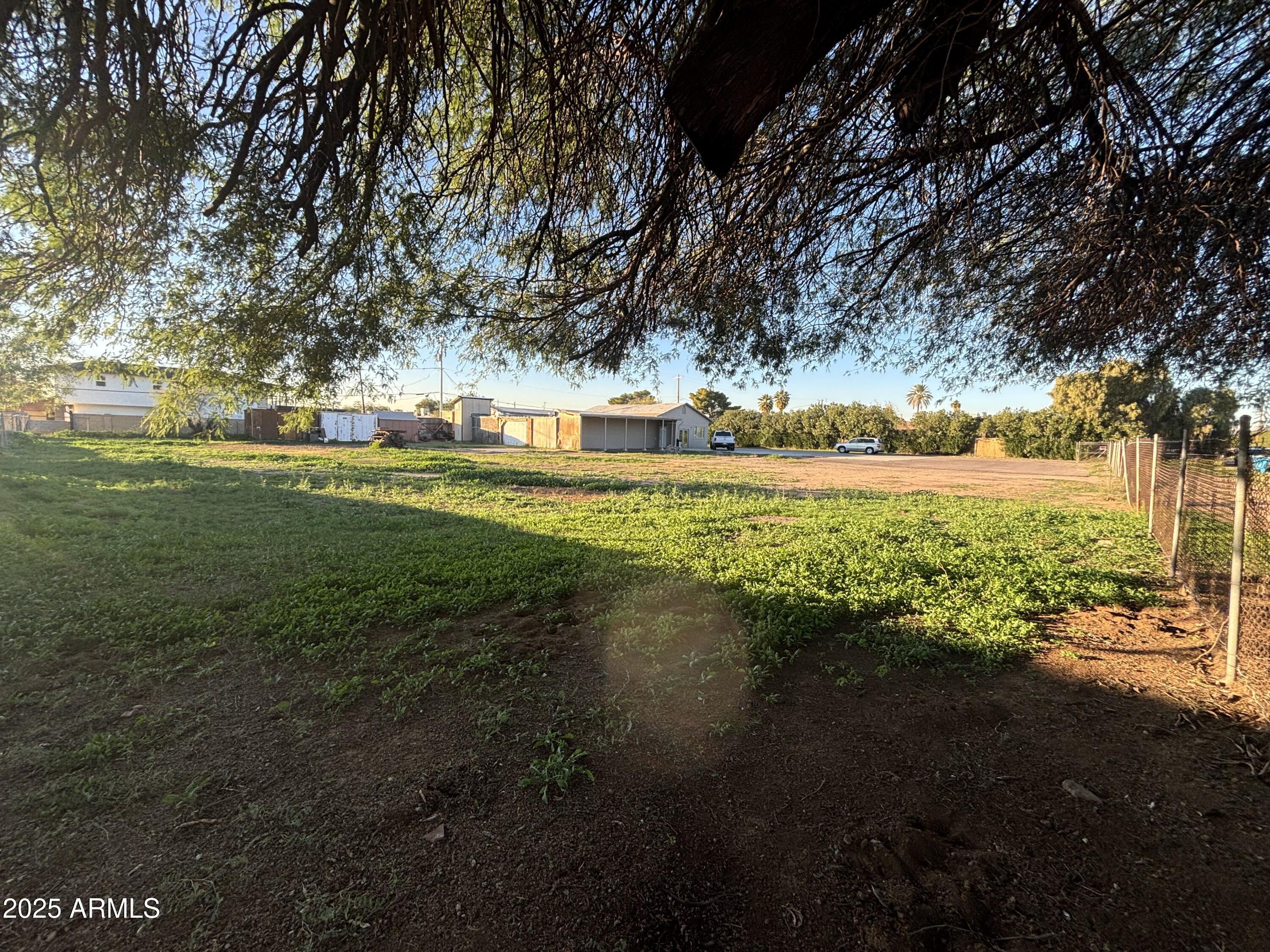 Central Phoenix development opportunity! Approximately 0.91 acres zoned for residential use property offers exceptional flexibility and future potential in a rapidly transitioning neighborhood in central Phoenix. Property includes an approx 3,000 sq ft warehouse, originally used for cabinet making, offering flexible utility and storage. Within the structure is an approx 494 sq ft guest quarters featuring a kitchen area, open living/sleeping space, and separate bathroom with shower, cooled by a mini-split system. Would make a great Live-Work space. Ideal for investors, builders, or owner-users seeking land with existing
improvements and multiple future possibilities. Convenient central location
near major corridors and amenities. Buyer to verify zoning, uses, and development
potential.