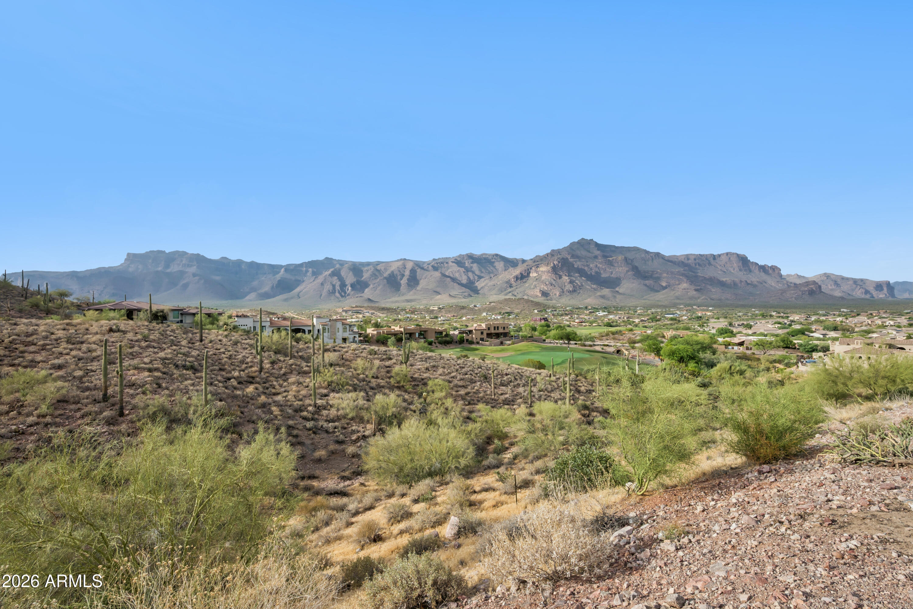 SPECTACULAR 1.1-acre hillside homesite in the prestigious Vista del Corazon community at the base of Dinosaur Mountain. Nestled among stunning custom estates and surrounded by the renowned Dinosaur Mountain Golf Course! Enjoy BREATHTAKING PANORAMIC VIEWS of the Superstition Mountains, lush golf course fairways, and Arizona's unforgettable desert landscape. The elevated setting provides exceptional privacy while offering the perfect backdrop to design and build your dream custom home. Located in one of Gold Canyon's most sought-after neighborhoods, this property combines luxury living with convenience--just 35 minutes from Phoenix Sky Harbor International Airport. Residents enjoy easy access to world-class golf, scenic hiking trails, outdoor recreation, & the natural beauty that makes Gold Canyon a premier destination. With low HOA fees and you have the flexibility in your build time to create your vision. Whether you're ready to build now or planning for the future, this exceptional homesite offers an unmatched opportunity in a truly remarkable setting. Vista del Corazon is an exclusive, luxury single-family home and land community in Gold Canyon, Arizona. Survey and County Plat map available.