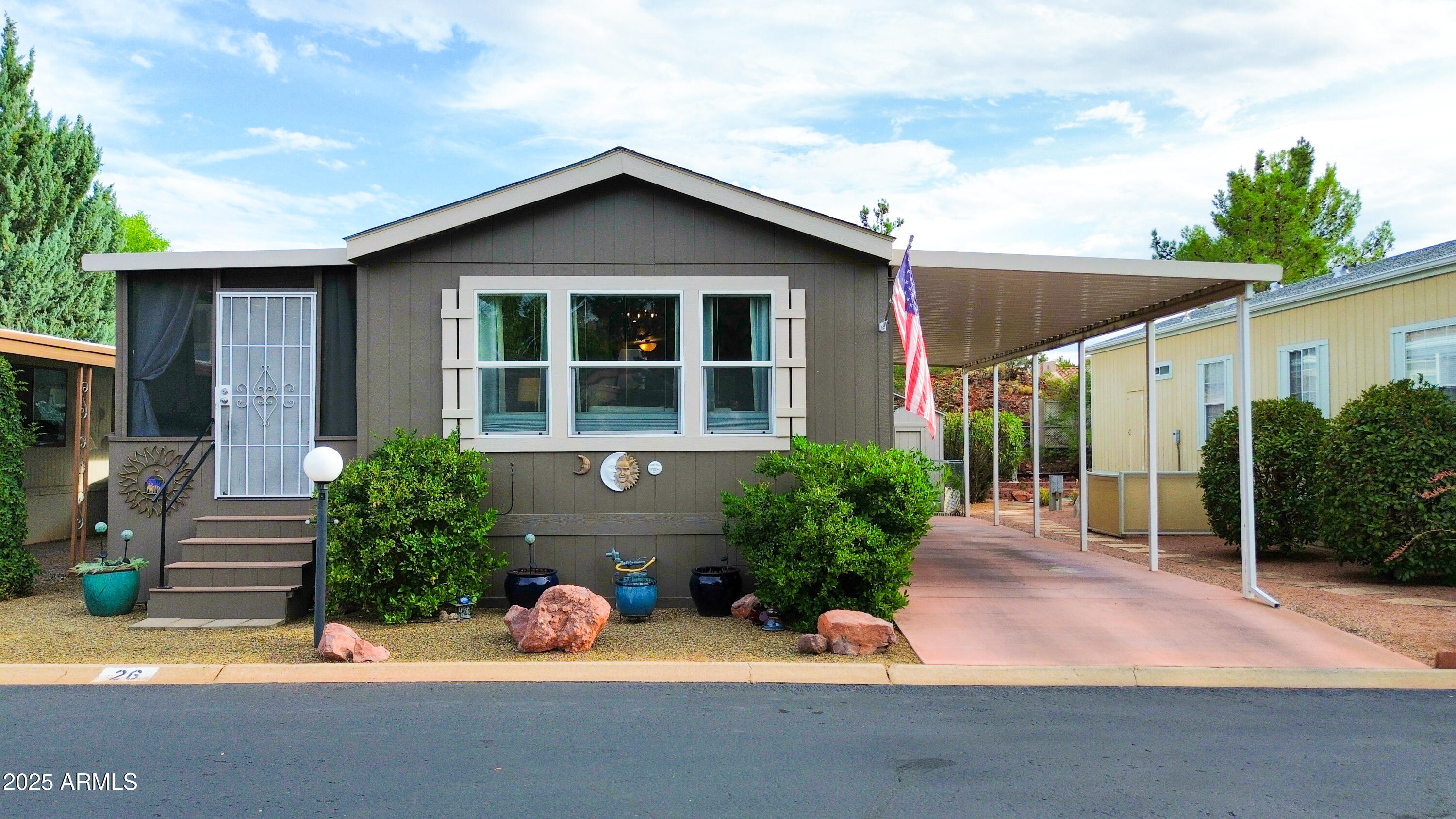 Peaceful Sanctuary w/ Gorgeous Red Rock Views! This Beautifully Maintained 2 Bedroom Cavco Home w/ Fully Renovated Workshop Located in a Tranquil 55+ Community in the Heart of West Sedona Features: AZ Room. Lovely Open Floorplan. Vinyl Plank Floors. Carport. Workshop w/ Electricity, Walls, Flooring, Paint, Ceiling Fan. Private Fully Fenced Backyard w/Grass. Some of the Home Improvements Include: Neutral Paint Colors, New Fixtures, New Flooring, New Kitchen Sink Faucets, New Porch Painted & Screened-in incls patio rugs. New Landscape throughout entire Backyard. *Buyer has the option to buy furnishings through separate bill of sale. Sunset Village offers a community pool & clubhouse & is centrally located just minutes from shopping, theaters & parks! Must see!