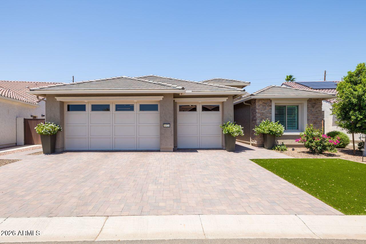 Elegantly  upgraded home in the prime ''Eye'' location of Tuscany Falls in The Premier Golf Course community of PebbleCreek! From the paved driveway and entry, stone enhanced facade, to the extended travertine covered patio, you're surrounded by quality & upscale design with every step! This property has 2 full ensuites, den and powder room. The unique tile entry, welcomes you to an open concept space flowing with natural light, the kitchen features modern herring bone design porcelain tile back splash, stainless steel appliances, gas cook top, hood, convection wall oven and 42-inch cabinets with dovetail joints, soft close drawers and pull-out shelves galore. A walk-in pantry stocks the gourmet chef's kitchen. You'll love the perfect balance of Modern and French Farmhouse style The Den has built- in bookshelves and cabinets, creating streamlined organization. Trayed ceiling details in entry and living 
room add an architectural element and high-end design.
The Extended Air conditioned garage is over-sized height, with built-in cabinets, sink, Pinnacle Water Filtration System, RO and epoxy floor finish. The Garagehas a side door access to the yard for trash containers.  Rain Gutters, High-end landscape includes  a gorgeous heated pool, Pentair Control System, Flagstone stepping stone path behind the gates on either side of the house for a meandering view of landscape plantings and ease of access to the backyard. Entertain in luxury with the Pergola covered BBQ island, and the outdoor fireplace, room for ample seating on the Travertine finished patio to host those holiday gatherings.
Raised tiered planters on the east side of the house are ready to plant those fresh herbs to stock that gourmet kitchen with the freshest ingredients.  Owned Solar rounds out the many upgrades to give you energy cost savings too. This home delivers all you need to enjoy the creature comforts of luxury living in Pebblecreek.