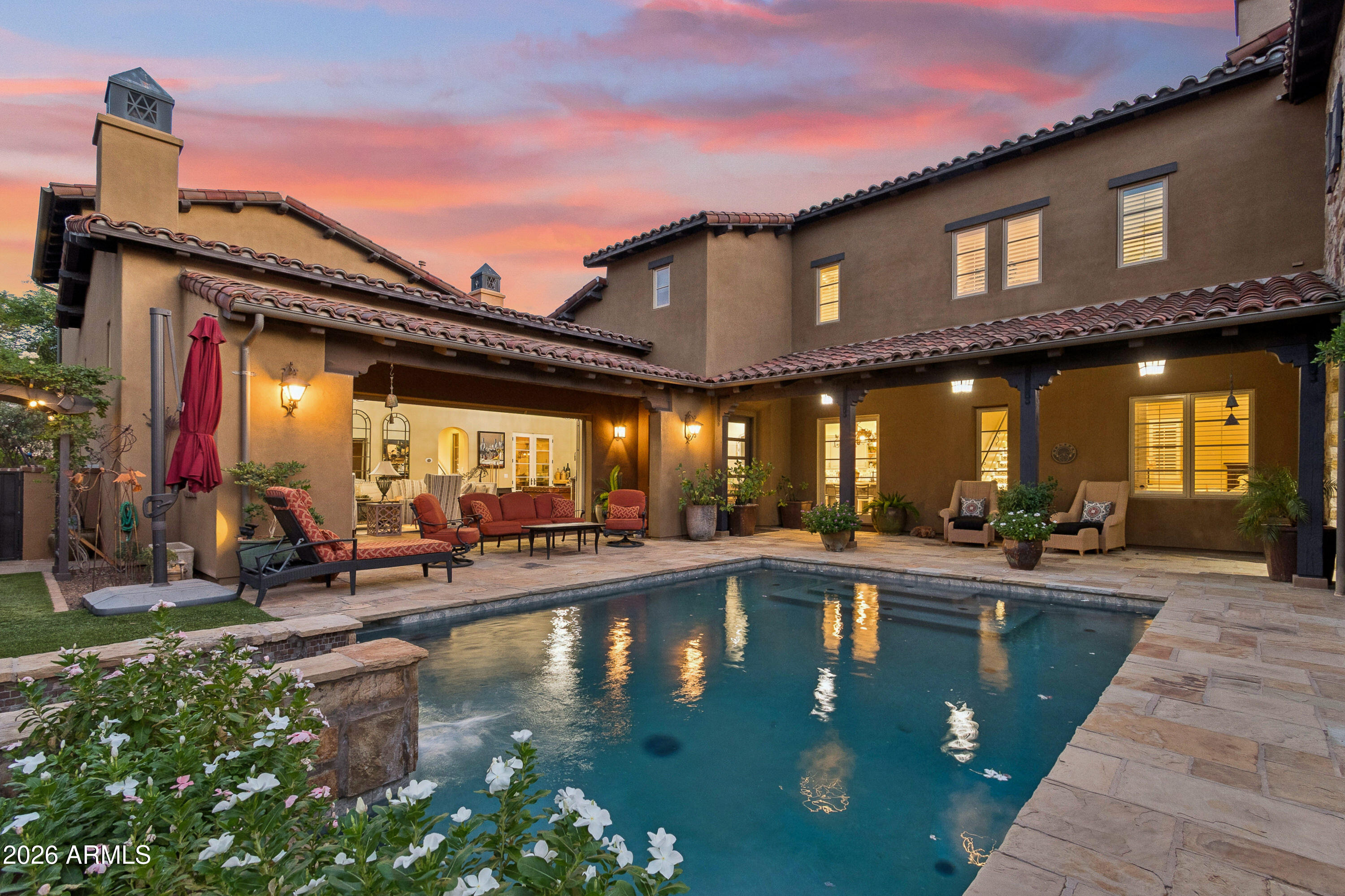 For those who have earned the very best Arizona has to offer, there is only one destination.

Set within Silverleaf -- Arizona's most coveted private community and the undisputed pinnacle of Southwestern luxury living -- this residence delivers the rare combination of architectural distinction, curated interiors, and an effortless indoor-outdoor lifestyle that discerning buyers recognize as non-negotiable.

The home announces itself with striking curb appeal and a commanding stone facade before revealing an interior where warmth and refinement coexist without compromise. Wide-plank hardwood flows through the main living spaces beneath vaulted ceilings, custom millwork, hand-selected stone accents, and elegant iron details that signal craftsmanship at every turn. The great room opens through stacked glass doors to the main courtyard - a private outdoor world unto itself, where a stunning pool, built-in grill, covered patios, ramada, and a dedicated covered entertainment lounge with hot tub flow together effortlessly, every finish speaking the same language of absolute luxury. 

The kitchen is built for those who live well. White beamed ceilings, two-tone cabinetry, an oversized eat-in island, and a full suite of professional-grade Wolf, Sub-Zero, and Viking appliances make it equally suited for a quiet morning or an evening of entertaining. The adjacent dining room - coffered ceilings, curated lighting - sets the stage without overstating it.

The primary suite is a private retreat in every sense: a wood-burning fireplace, multiple French door exits, a generous sitting area, and a spa-caliber bath with marble flooring and wall detailing. A private balcony frames sweeping McDowell Mountain views and city lights at golden hour. Additional guest suites are positioned for maximum privacy - a floor plan designed with intention, not convention.

Beyond the property line: world-class golf, the Silverleaf Clubhouse, community parks and open green space - all within a guard-gated environment that prioritizes privacy above all else.

To live here is to occupy a position very few will ever know - and even fewer will ever leave.