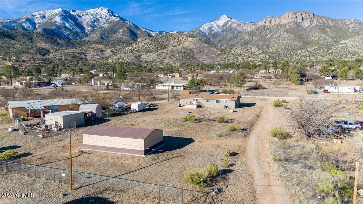 This home has all the room you need (2300+ square feet), plus there is a huge 24' x 40' shop for your workout area, workshop, car storage, or more!!!  The shop features a metal roof and has a slab foundation with extra rebar, wire mesh in it,  and 4500 psi concrete.    The floor is epoxy covered, and there is insulation in the shop. There are 3 bay doors and a pedestrian door.  Still need more room? There is also a 12' x 10' shed! The home features vaulted ceilings throughout!  There are 2 living areas; 1 features a wood fireplace.  Lots of storage space in the kitchen, gas range.  The dining room has built in hutch features.  The owner's suite is large and spacious!!!  So much to see with this property!