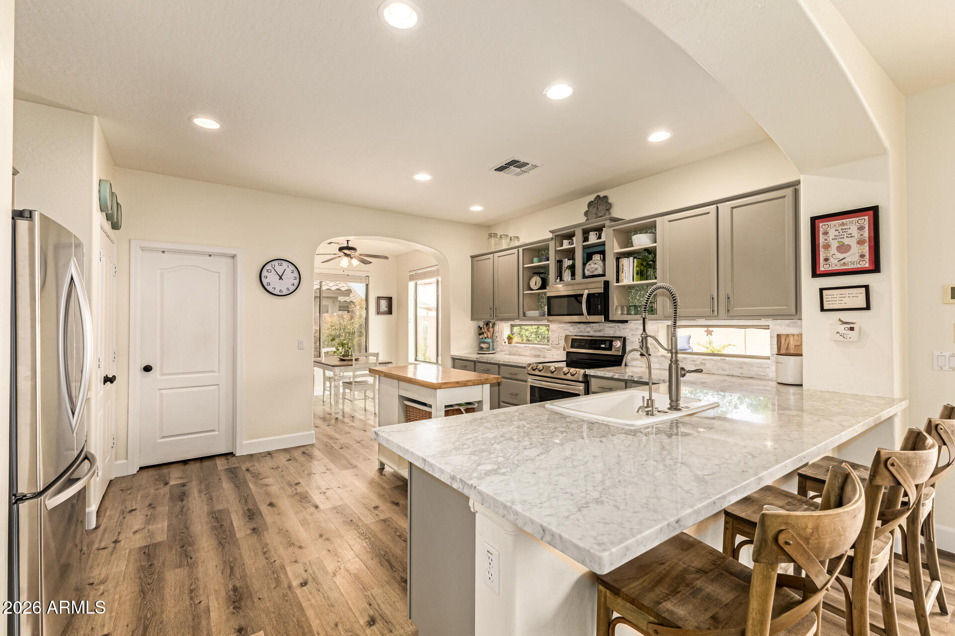 MOVE-IN READY home near the breathtaking Superstition Mountains in Gold Canyon. This stunning 4-bed, 3 full bath home delivers the perfect blend of comfort, style, and peace of mind.
ALL THE BIG TICKET ITEMS ARE DONE FOR YOU! NEW ROOF UNDERLAYMENT (Feb 2026, Transferable Warranty); EXTERIOR + BLOCK WALL PAINTED (Feb 2026); TWO A/C UNITS + FURNACE (May 2022, Transferable Warranty); UPDATED POOL EQUIPMENT + LIGHTS (June 2025). PLUS LUXURY VINYL PLANK FLOORING throughout - NO carpet. **Over $125K in improvements!** Inside, this home feels light, bright, and incredibly livable. The spacious kitchen shines with professionally painted cabinets (Feb 2026), Carrera marble counters, stone backsplash, stainless appliances including a counter-depth fridge. The flexible floor plan offers a main-level bedroom with adjacent full bath - perfect for guests or multi-gen living. Upstairs, the expansive primary suite easily accommodates a king bed, full-size couch, and more. Enjoy a spa-like bath with garden tub, separate shower, private water closet, and large walk-in closet. Wake up to SUPERSTITION VIEWS from all three upstairs bedrooms. A generous loft and charming turret-style bonus room add character + versatility for office, playroom, gym, or creative space.
Outside, your PRIVATE BACKYARD RETREAT awaits - large pool + spa, covered patio, pavers, planter beds, gas firepit, and low-maintenance desert landscaping. A split 3-car garage, extended driveway, and double gate complete the package.
SUPERSTITION FOOTHILLS is a beautiful community just off 60E  with LOW HOA fees. 35 minutes from Sky Harbor; 20 minutes from Mesa Gateway. This home is walking distance to the Community grass park & large year-round heated pool & spa + 52 walking/hiking trails. **ONE MILE drive to grocery shopping, dining, Starbucks, and a variety of amenities. Nearby HIKING, BIKING AND SXS TRAILS abound! WORLD CLASS GOLF is just minutes away. Come see for yourself what Gold Canyon has to offer! Globemallow Lane is quiet, inviting, and thoughtfully updated - this is Arizona living at its finest. OWNER/AGENT