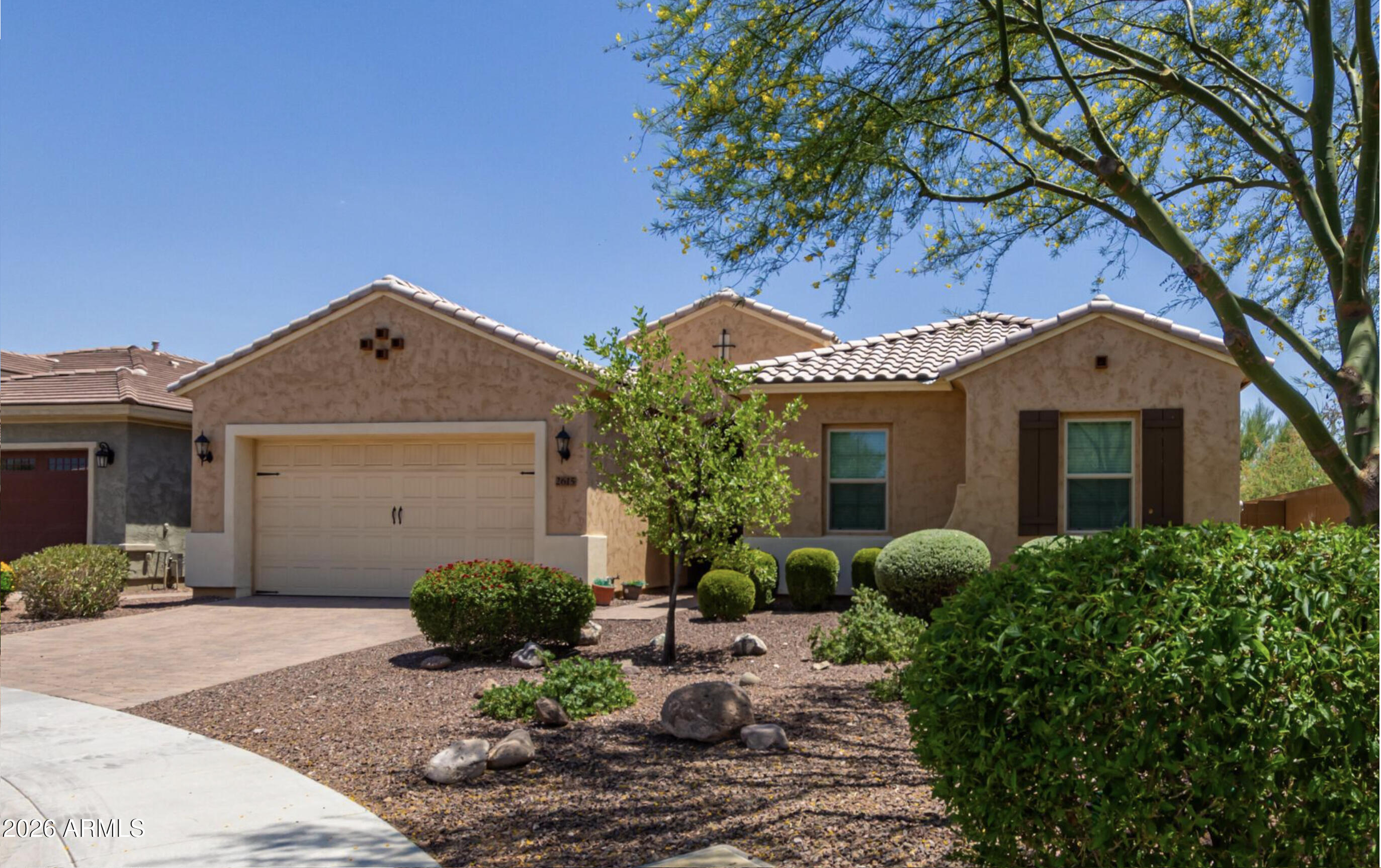 Welcome to this charming 4-bed, 2.5-bath rental home in Sonoran Commons! Sits on a corner lot adjacent to a common area, it displays a well-manicured front yard & a 4-car tandem garage. Inviting interior features a welcoming foyer, neutral paint, tons of natural light, and wood-look tile flooring w/carpet in bedrooms. Formal dining room w/a chic chandelier! The gourmet kitchen seamlessly combines with the HUGE living room for easy access or connections. It offers ample white cabinets, tile backsplash, SS appliances, granite counters, a walk-in pantry, & an island w/breakfast bar. Main bedroom has backyard access and an ensuite with a separate tub/shower, dual sinks, & a walk-in closet. Enjoy the entertainer's backyard boasting a covered patio, lush lawn, & a sparkling pool! Don't miss it!