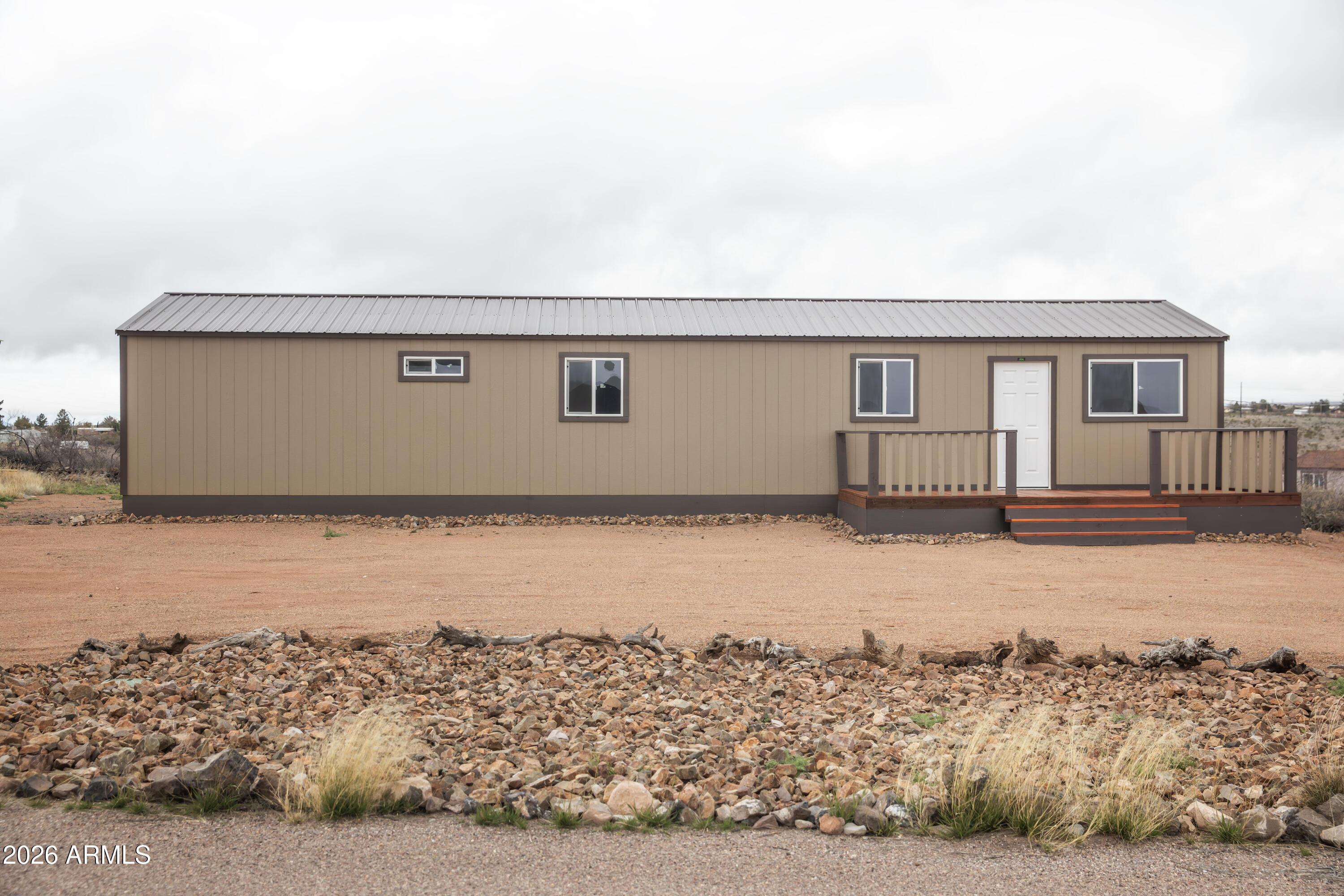 Don't miss this incredible opportunity to own a brand-new home in historic Tombstone, surrounded by breathtaking mountain views. Purchase the home as-is and make it your own. Or take advantage of a unique opportunity to have it completed and customized by a respected local licensed contractor with $30,000 down payment, you can customize your dream home with your choice of paint colors, countertops, flooring, cabinetry and appliances and even add an additional bedroom- creating a space that perfectly reflects your style and vision. Enjoy small-town charm, rich history, and stunning desert scenery all in one exceptional property!