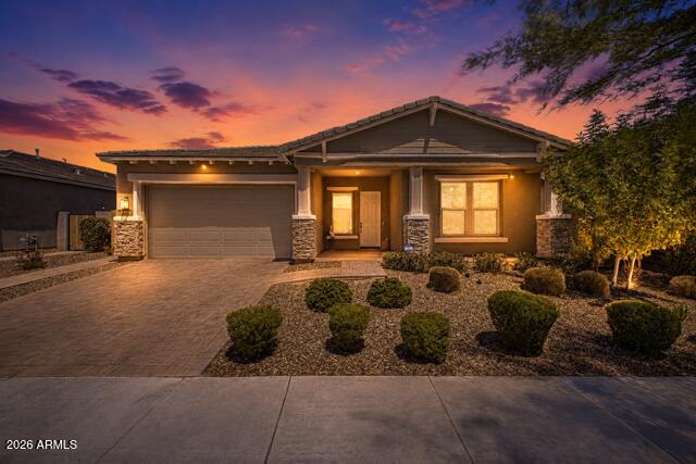 Welcome to luxury living in the award-winning Eastmark community, where thoughtful design, exceptional upgrades, and resort-style amenities come together to offer the very best of Arizona living. This beautifully appointed 3-bedroom, 2.5-bath residence with two versatile flex spaces offers approximately 2,703 square feet of stylish, functional living designed to fit today's lifestyle.

At the heart of the home is a stunning gourmet kitchen that is sure to impress, featuring elegant quartz countertops, a classic subway tile backsplash, stacked upgraded cabinetry, premium stainless steel gourmet appliances, a gas cooktop, an oversized island, and an expansive walk-in pantry. The open-concept floor plan flows effortlessly into the spacious great room, while a dramatic multi-slide glass door creates seamless indoor-outdoor living and fills the home with an abundance of natural light. Beautiful wood-look tile flooring extends throughout the entire home, offering both elegance and durability with no carpet anywhere.

The spacious primary suite provides a peaceful retreat with a spa-inspired bath featuring dual vanities, a luxurious walk-in shower, and an oversized walk-in closet. Two additional generously sized bedrooms and two flexible bonus rooms provide endless possibilities for a home office, media room, fitness space, playroom, or potential additional bedrooms to suit your needs.

Step outside to your own private backyard oasis, thoughtfully designed for low-maintenance living without sacrificing luxury. Relax year-round in the sparkling heated pool with tranquil water feature, unwind in the therapeutic spa, or entertain family and friends on the expansive travertine patio while enjoying Arizona's beautiful weather.

Located in one of the Valley's most sought-after master-planned communities, Eastmark offers an unmatched lifestyle with The Mark community center, resort-style pool, splash pad, parks, playgrounds, event pavilion, disc golf course, community lake, miles of walking and biking paths, Steadfast Farm, seasonal events, concerts, food truck nights, and an incredible calendar of community activities. Conveniently located near top-rated schools, shopping, dining, golf, entertainment, Phoenix-Mesa Gateway Airport, and Loop 202, this exceptional home offers the perfect blend of luxury, comfort, and community.