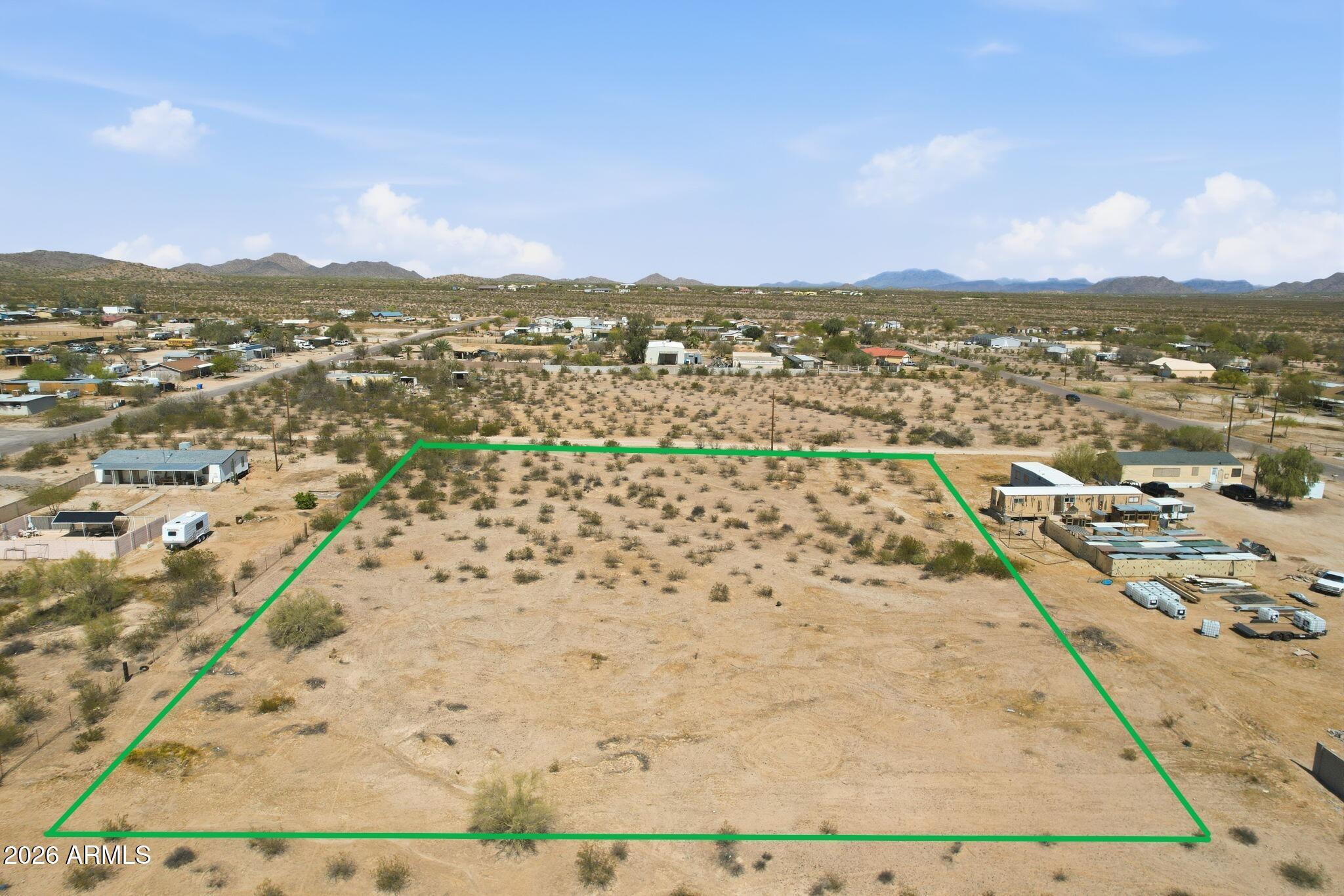 Seller open to reasonable cash offers for a quick close. Build-ready 1.85-acre parcel in a growing Casa Grande location! This flat, usable property sits between two existing homes on W Watson Way, with power at the lot line and water service available in the area (buyer to verify connection options). Enjoy mountain views, open desert surroundings, horse privileges, and no HOA. Ideal for a custom home, workshop, small ranch setup, or future expansion. Convenient access, nearby established utilities, and surrounding development provide the perfect blend of rural living and everyday convenience. GIS measurements show approximately 1.85 acres; county records reflect 1.52 acres. Buyer to verify all material facts, acreage, utilities, and intended use.