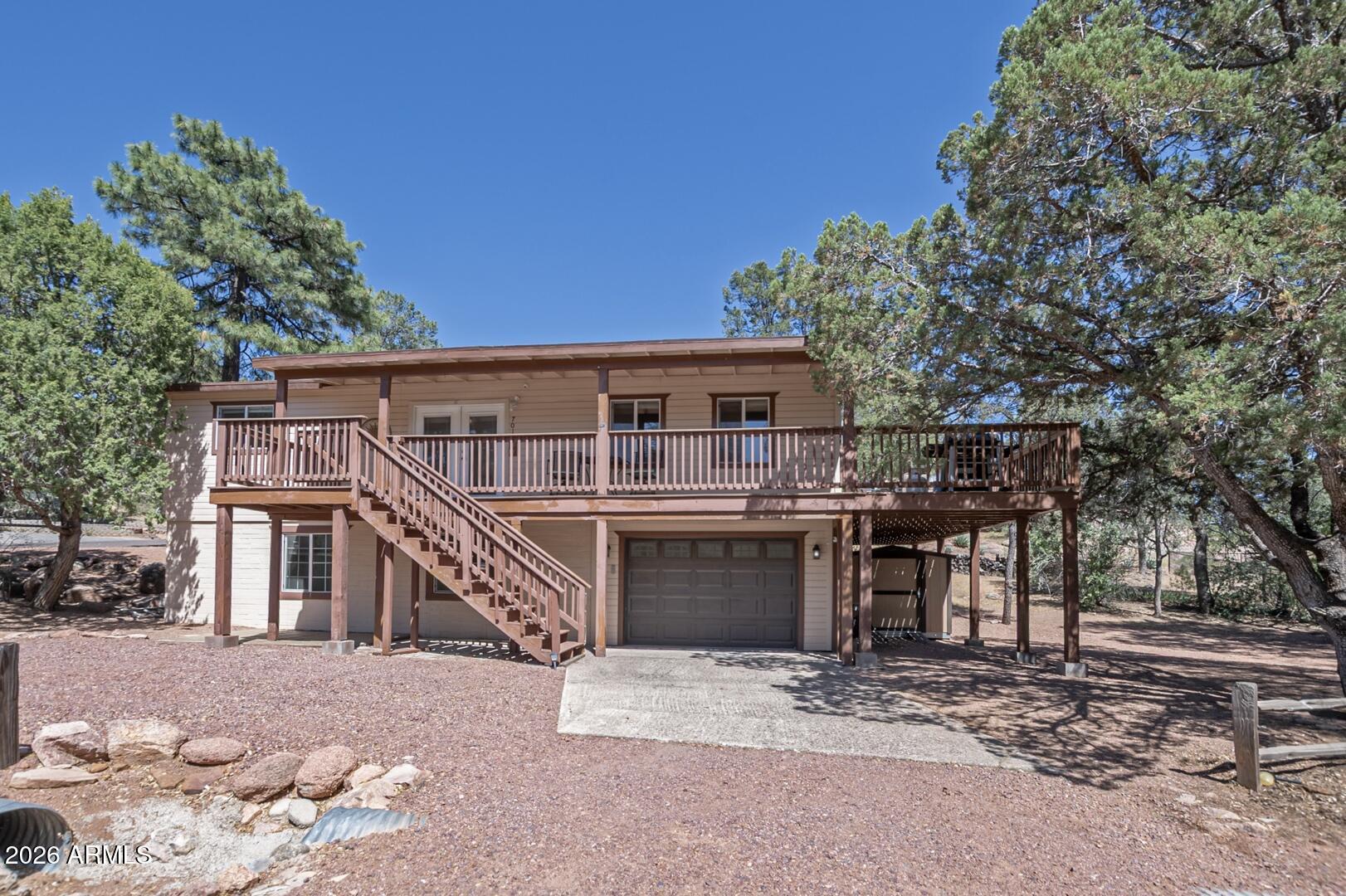Welcome to this spacious and versatile updated 4-bedroom, 3-bath home nestled in the charming mountain town of Payson! Whether you're looking for a full-time residence, a relaxing second home, or an income-producing short-term rental, this property offers the perfect combination of comfort, functionality, and flexibility -- with NO HOA.  Enjoy the beautiful wrap-around deck featuring both covered and uncovered areas, perfect for entertaining, relaxing, or taking in the fresh mountain air year-round.  The main level features an inviting living room and a well-appointed kitchen complete with a large island, abundant cabinet storage, generous counter space, and a built-in microwave. The extra-large primary suite offers plenty of room to unwind, along with an oversized  CLICK ''MORE' primary bathroom designed for comfort and convenience. A spacious second bedroom and full guest bathroom complete the main floor.  Downstairs, you'll find a large family room ideal for gatherings, game nights, or additional living space, along with two additional bedrooms and another full bathroom -- perfect for guests or multi-generational living.  The 1-car garage includes a laundry area plus extra space for tools, storage, or a workbench for hobbies and projects.  A separate storage shed offers even more space for outdoor equipment, hobbies, or seasonal items.  Located in desirable Payson, this home combines mountain-town charm with practical living spaces and investment potential. Don't miss this opportunity to own a property with endless possibilities!