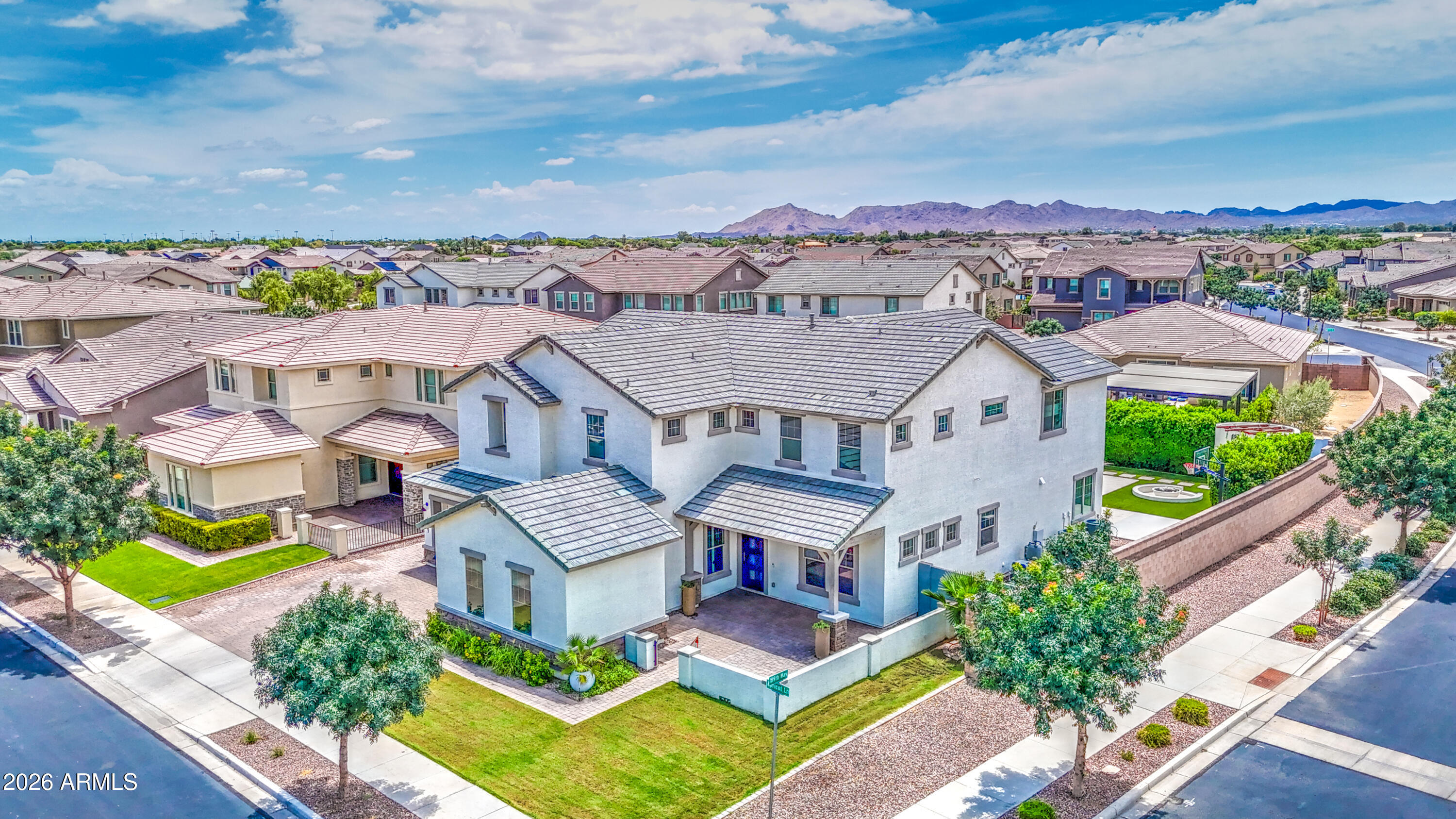 This stunning property leaves absolutely nothing to be desired. It's basically got it all! Located on a corner lot with North/South exposure in the stunning community of Legado in Queen Creek. It has single & double car garages and simply amazing curb appeal. Offering 5 huge bedrooms, tile flooring throughout, an amazing loft, and 3.5 bathrooms. The kitchen has stainless steel appliances, island with breakfast bar, large pantry, upgraded cabinets, pot filler over the stove, tile backsplash, and quartz countertops Fireplace in the living room Elegant entryway and staircase. Primary Bedroom downstairs tucked away in the back corner. Primary Bath with garden tub, separate shower, and his/her closets.  There are honestly too many features to list. Come see this gem for yourself.