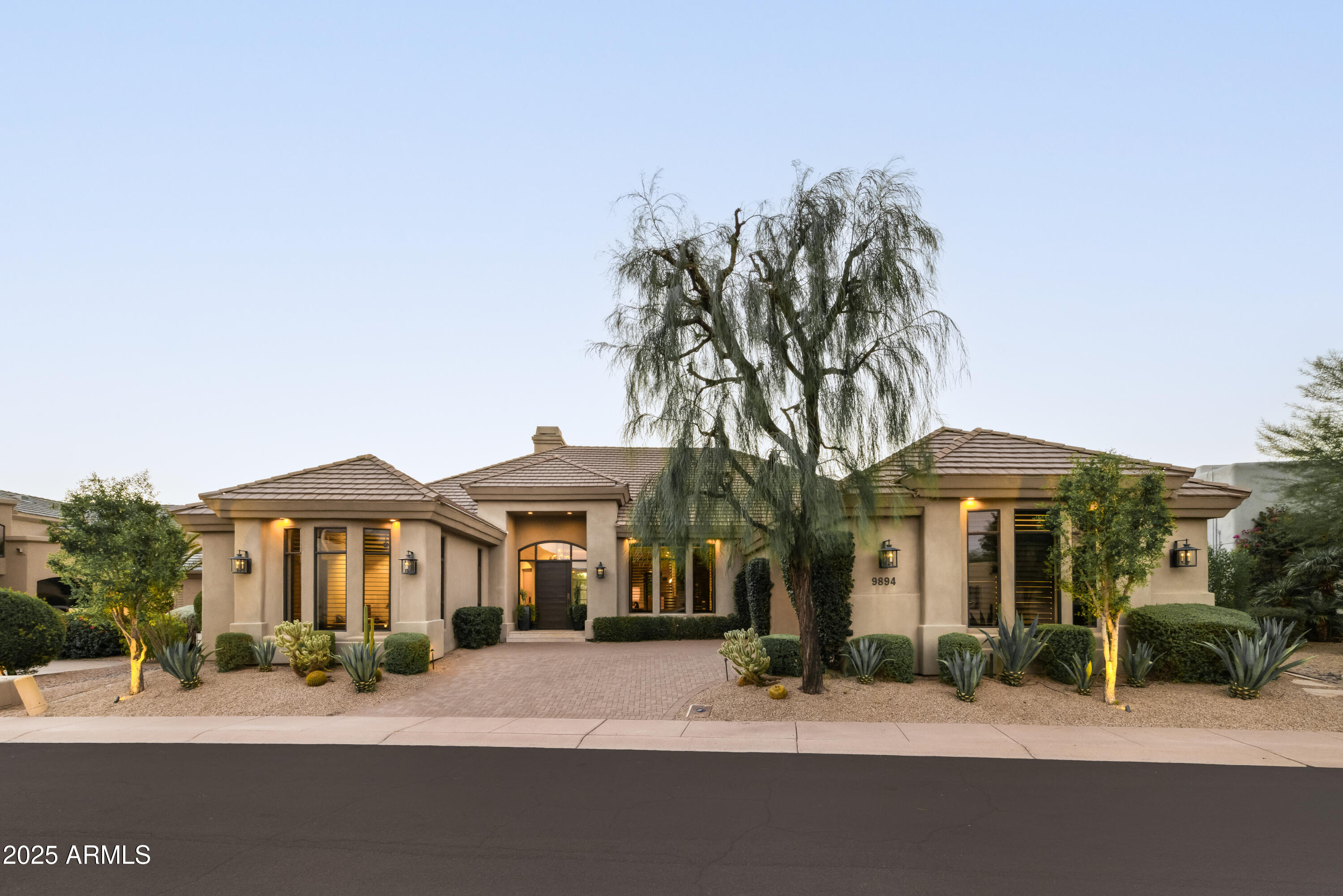 Welcome to this Jewel Box in North Meadows II. Completely reimagined in 2020 by Nance Construction, this stunning residence in the gated community of North Meadows II is the perfect blend of luxury, charm, and thoughtful design. Every detail has been carefully considered—from the reclaimed doors and custom wood beams to the exquisite millwork and functional layout that makes living both beautiful and seamless.

As you enter through the inviting foyer, you're welcomed by a spacious formal dining room that flows effortlessly into the elegant living area. The heart of the home is the chef's kitchen, outfitted with rich countertops, abundant storage, premium appliances, and an expansive island perfect for entertaining or everyday living.

The family room is a showstopper, featuring a striking saw-cut stone accent wall and surrounded by beautiful windows and doors that bring in an abundance of natural light and connect the indoors with the resort-style backyard. Step outside to enjoy a generous covered patio, built-in BBQ, and a sparkling pool all overlooking serene golf course views.

The primary suite is a true retreat, offering tranquil views, a luxurious bathroom with dual vanities, soaking tub, and a large walk-in closet. With 5 bedrooms, 5.5 bathrooms, and a spacious 3-car garage, there is room for everyone without sacrificing comfort or style.

Located in the coveted Gainey community, residents enjoy access to premier amenities and the security of a private gated setting. This is a rare opportunity to own a thoughtfully designed home where no detail has been overlooked.