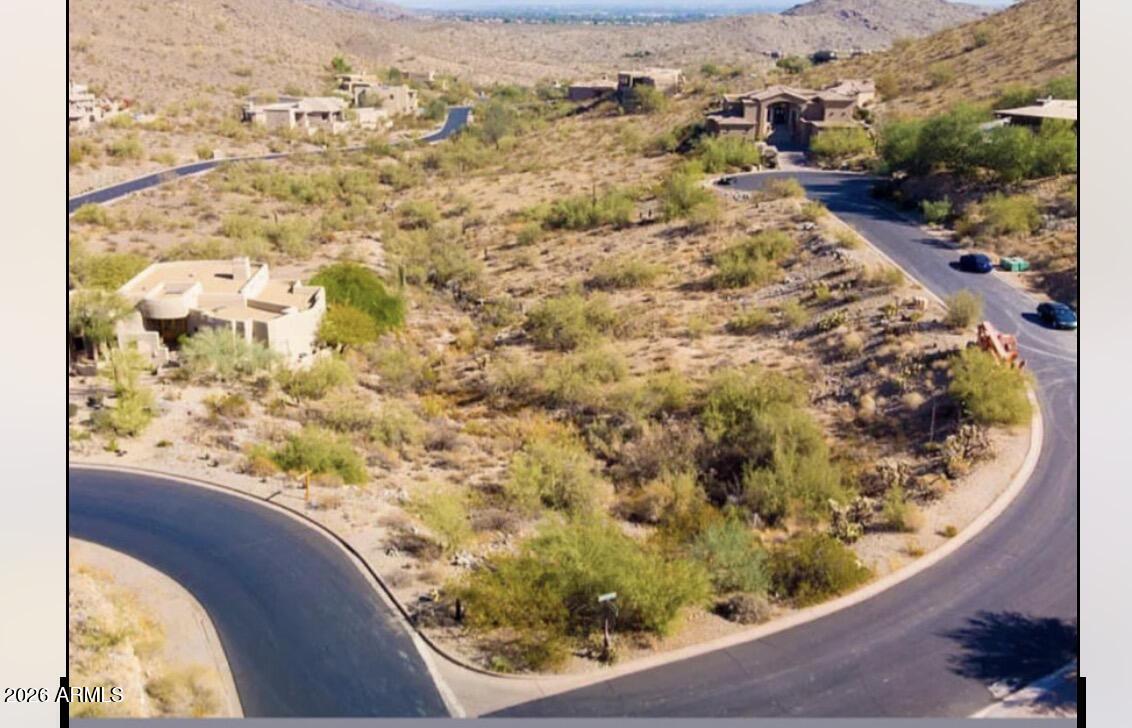 Gated community land!! This lot is in an a custom residential subdivision with view lots. Build your dream home on this spectacular elevated lot in Ahwatukee / Tapestry Canyon. Corner lot leading into a culdesac with both city and mountain views.  Plans originally were  for about 4100 SF livable home.. This lot is a gem and one of the best lots in this neighborhood.
Home plans must submitted to the HOA for approval.