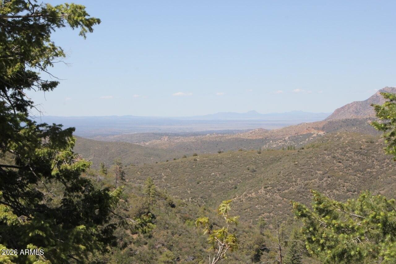 14 Acres in Highland Pines Near Prescott, Arizona - Custom Home Site Bordering Prescott National Forest
Rare opportunity to own 14 private acres in the beautiful Highland Pines area near Prescott, Arizona. This custom home site is nestled in the wilderness of Northern Arizona at an elevation of approximately 5,300 feet, offering mild summers, light winter snows, and year-round sunshine.
Enjoy breathtaking panoramic views of surrounding mountains and wilderness valleys with no neighboring properties interrupting the scenery. The property offers exceptional privacy and seclusion, bordering Prescott National Forest on two sides, creating the feeling of an expanded backyard with endless room to explore.
This scenic parcel provides the perfect setting for a custom mountain retreat, cabin get