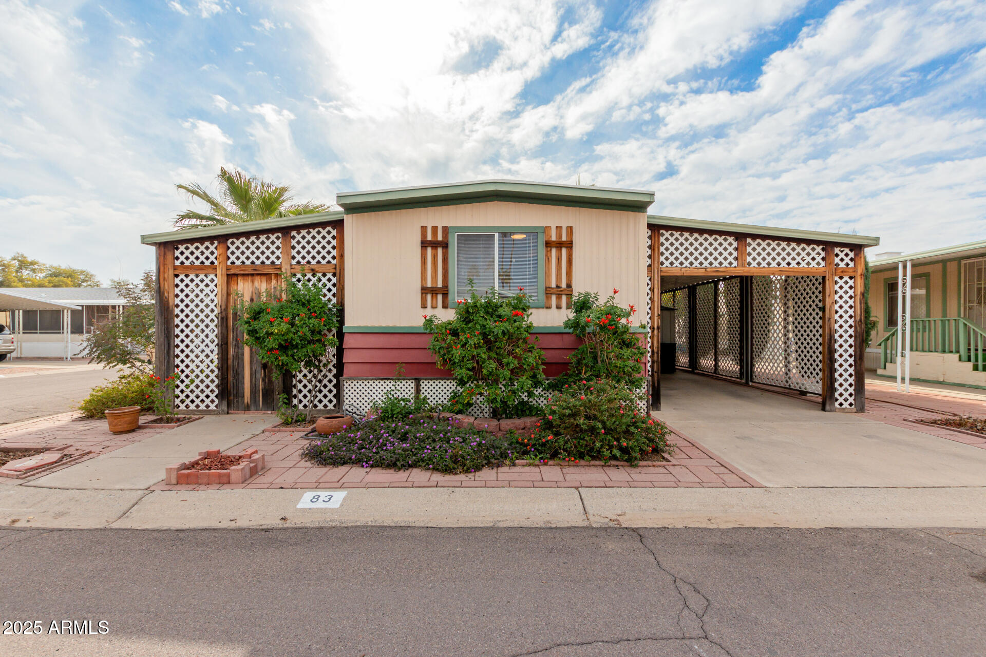 MOVE-IN-READY! Nestled on a coveted large corner lot in the vibrant 55+ Phoenix North Mobile Home Park. It's great location, close to variety of SHOPPING AND EATING venues.. This delightful mobile home is ready for a new owner! You'll be welcomed by tile and wood-look flooring that flows throughout, creating an inviting ambiance. Cozy living room invites relaxation, while the kitchen boasts matching white appliances, ample counters, and abundant cabinetry for all your storage needs. Main bedroom offers a peaceful retreat with its private bathroom. Outside, unwind on the covered patio, perfect for enjoying your morning coffee or peaceful evenings. This wonderful community provides fantastic amenities, including a refreshing pool, a relaxing spa, and more! Financing Available See it today!