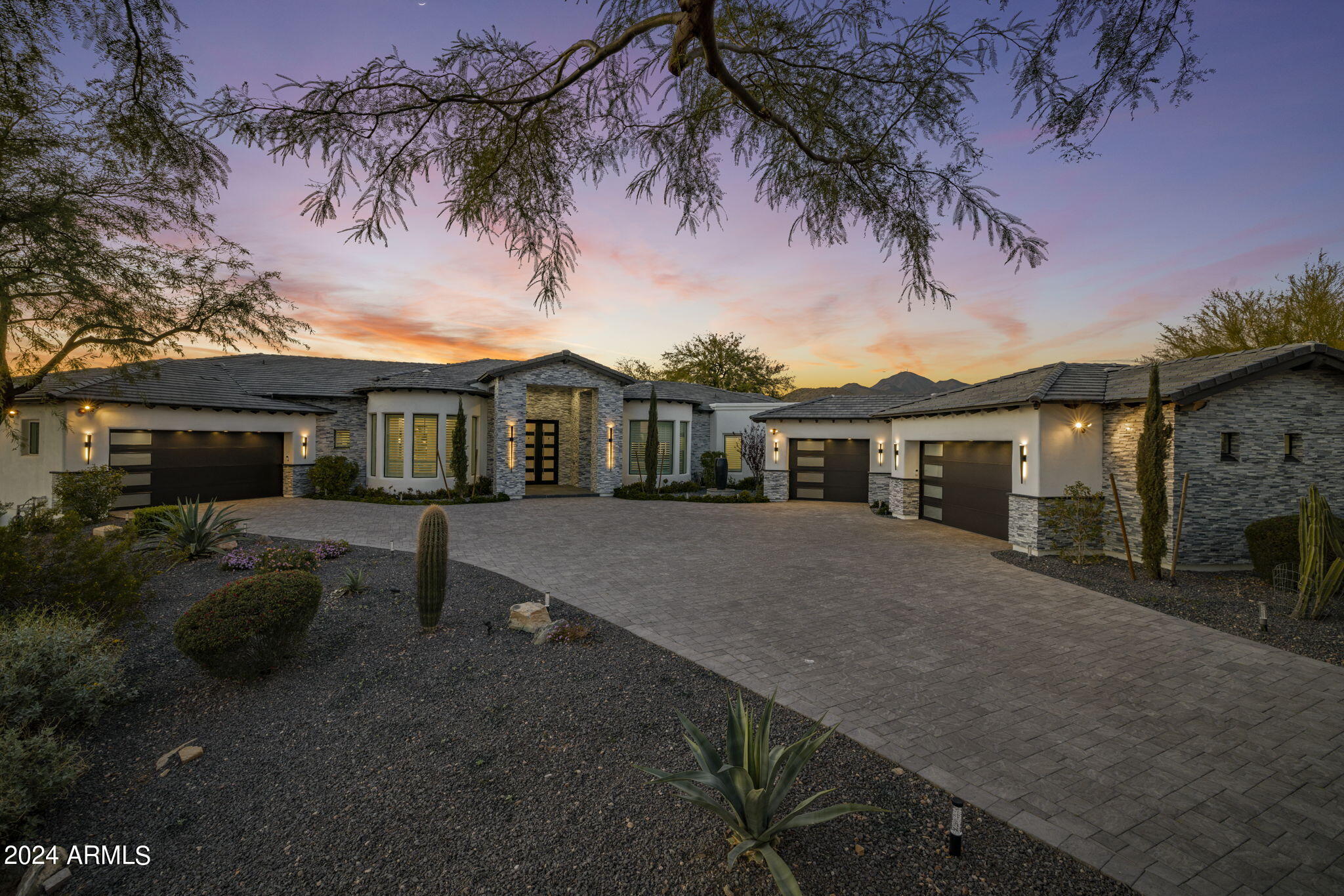 Immaculately remodeled and upgraded in 2022 to embody the finest elements in today's trends, this 6,650+ square foot cul-de-sac home is spread over 1.3 acres, with an open NAOS space and mountain views - making this your very own expansive and private compound . Breathtaking Desert Contemporary AZ Estate, (AVAILABLE TURN KEY FURNISHED)
combines modern elegance with the highest standards of sophisticated living. Designer Details flourish both inside/out, peaking in architectural accomplishment, blending modernity with the natural aspects that surround it. A heated pool/spa, expansive covered lanai built with entertainment in mind - w/space for over 100 people, full outdoor kitchen that redefines luxury lifestyle in every way. This 5 bed/8 bath interior exudes a luxury resort ambiance. With volume ceilings, hardwood floors, and dramatic wall and ceiling details that flow harmoniously throughout the main living areas. The exquisite quartz stone countertops complement the expansive executive chef's kitchen custom island, cabinetry, and Wolf appliances - which include a double fridge and freezer, and 60-inch range, with multi addition overs. 2 primary en-suites in addition to all bedroom en-suites, primary includes a private paradise featuring separate his/her baths, 10-foot walk-in shower and huge h/h closets and dramatic bathroom finishes, a freestanding tub, and morning bar. Additional features include Media/theatre with full quartz countertops, Wet bar and wine refrigerator, additional space for 25x25 casita, 3 fireplaces, oversized 6-car garage. Come see for yourself and enjoy this indoor/outdoor luxury experience in the heart of Scottsdale. NO HOA!