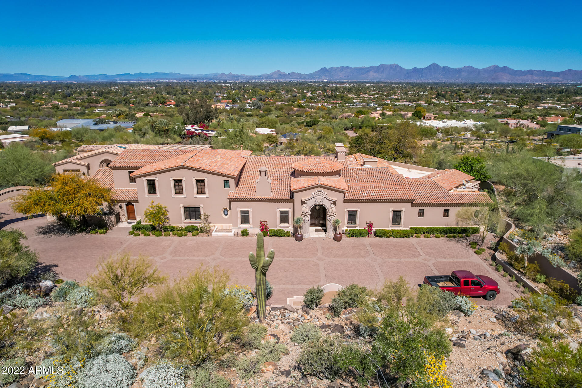 Price reduction! A perfect 10 in design, quality of construction and location. Ken Brown built main house located on the prestigious north side of mummy mountain situated on a 2.18 acre estate lot. Expansive views from here to kingdom come. North / South orientation. Unbelievable master suite with his and her everything. This gated estate offers a huge paver drive which can park over 20 cars.  Detached 1500 sqft 2bed/2 bath guest house built by Kitchel and designed by Brent Kendell offers a balcony with breath taking views and pool access. Main home offers 3 car garage with a/c and guest house offers an additional garage. This is a one of a kind legacy property 

Listing agent related to owner.