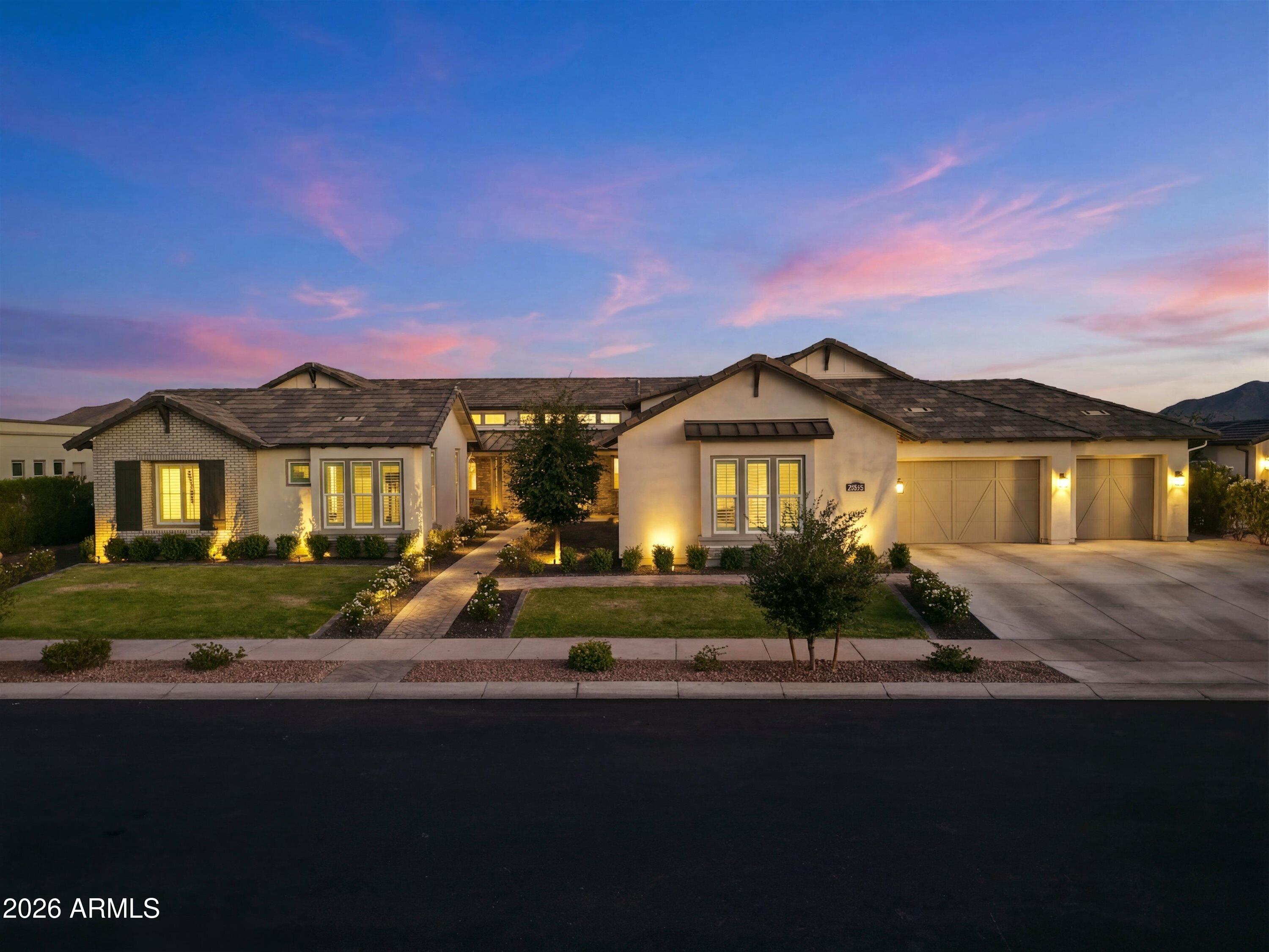 EXTRAORDINARY OPPORTUNITY... Experience luxury living at its finest in this exceptional estate nestled within the exclusive gated community of Whitewing at Whisper Ranch. Extensively enhanced with over $475,000 in post-construction upgrades, this residence delivers an unmatched combination of elegance, comfort, and resort-style amenities.

Every detail has been thoughtfully curated, from the premium Provenza luxury vinyl plank flooring that flows throughout the home to the custom built-ins, designer lighting, upgraded ceiling fans, motorized shades, Roman shades, and plantation shutters that elevate each living space.

Designed to impress, the chef's kitchen offers premium KitchenAid appliances, quartz countertops, abundant cabinetry, a spacious walk-in pantry, and a beautifully crafte breakfast nook featuring custom cabinetry and a built-in beverage refrigerator. The open-concept design creates an effortless connection between the kitchen, great room, and outdoor living areas, making this home ideal for entertaining and everyday living.

The backyard is nothing short of spectacular. Following the home's completion, nearly $200,000 was invested to create a private outdoor retreat featuring a custom heated pool and spa, expansive sandblasted travertine decking, elegant black iron fencing, a spacious Baja shelf, dramatic grotto, professional landscape lighting, and over $50,000 in lush front and rear landscaping. A private basketball and pickleball court adds yet another level of recreation to this incredible property.

The spacious floor plan offers 5 bedrooms, 4.5 bathrooms, and a private detached casita, providing exceptional flexibility for guests, multigenerational living, or a dedicated office or studio. The oversized four-car garage has been upgraded with epoxy flooring and an EV charging station.

Situated in one of Queen Creek's premier gated communities, residents enjoy beautifully maintained parks, greenbelts, and outstanding convenience to shopping, dining, entertainment, and everyday amenities.

Luxury homes with this level of customization rarely come to market. Every major improvement has already been completed, allowing the next owner to simply move in and enjoy an exceptional Arizona lifestyle.