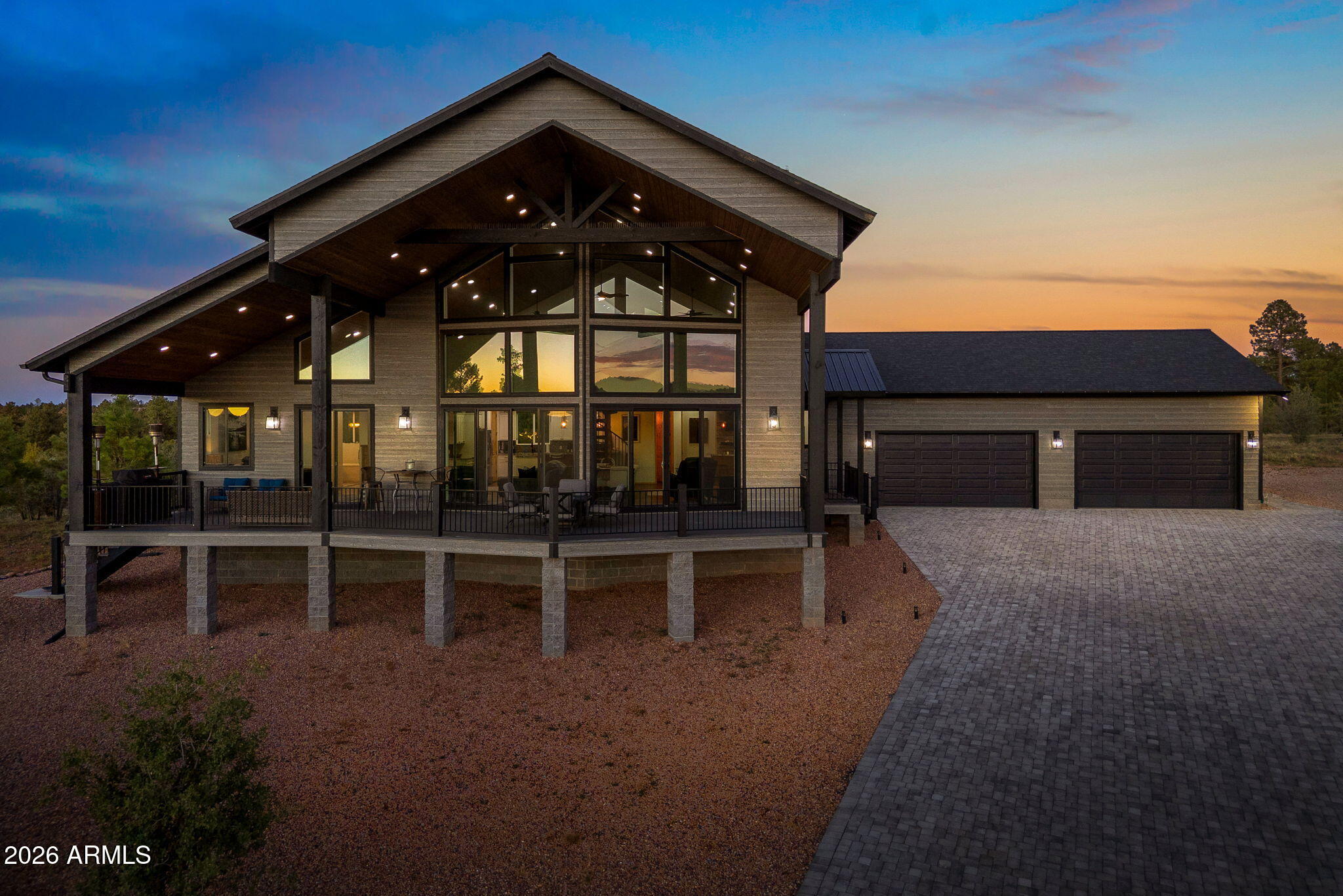 This magnificent mountain retreat is perched at the highest point in the subdivision, offering breathtaking views in every direction. Designed with custom touches and upgraded features throughout, this home is truly one to be experienced in person. From the exterior Trex decking, metal railings, & maintenance-free siding to the interior details like luxury vinyl plank flooring, granite countertops, soaring ceilings, and 2 fireplaces, every element has been thoughtfully crafted. The split floor plan provides excellent privacy, featuring 2 bedrooms connected by a Jack & Jill bathroom, along with a convenient powder room. The spacious primary suite includes a luxurious ensuite with a soaking tub, walk-in shower, and a stunning rock accent wall, creating a spa-like retreat right at home. So many extras that you need to see to appreciate. This is truly a one of a kind custom built home from the manicured yard with ample electrical both inside and out. A car lift in the garage for all your extra toys and it is even being sold furnished.  Available lot to the left of house is also available.