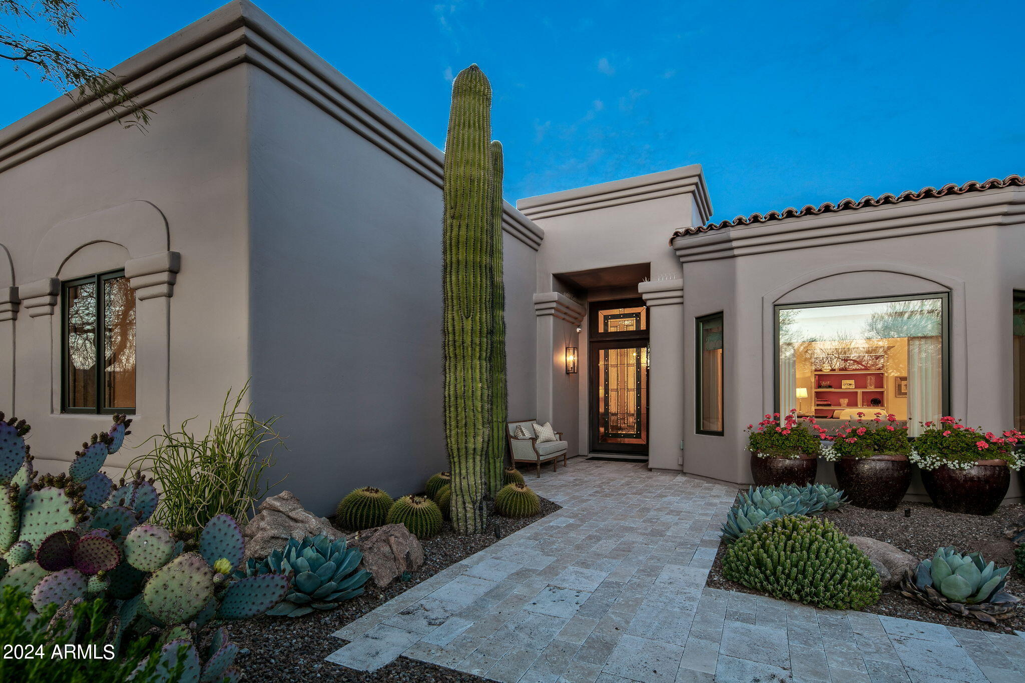 Welcome to this exquisite single-level home nestled on the 7th Fairway in the prestigious Desert Highlands community. Boasting 4 bedrooms and 4.5 baths, this fully remodeled residence offers the epitome of luxury living.Step inside to discover Brazilian cherry floors that seamlessly flow throughout the open-concept design. The chef's kitchen is a culinary masterpiece, equipped with top-of-the-line Wolf and Subzero appliances, marble countertops, and ample space for creating gourmet meals.Each room is a blend of elegance and comfort, featuring either Venetian plaster or sophisticated wallpaper. Masonry gas fireplaces add a touch of warmth and ambiance, perfect for cozy evenings.The backyard is an entertainer's dream, with a large pool and cascading waterfall set against the backdrop of breathtaking mountain views. Enjoy alfresco dining or simply relax on the entertainment patios, which grace both the front and rear of the home. The entrance patio welcomes guests with a comfortable sitting area and a roaring fireplace, setting the tone for the luxury that awaits inside.
Don't miss the opportunity to make this Desert Highlands gem your own, where every detail has been meticulously crafted for your utmost enjoyment.