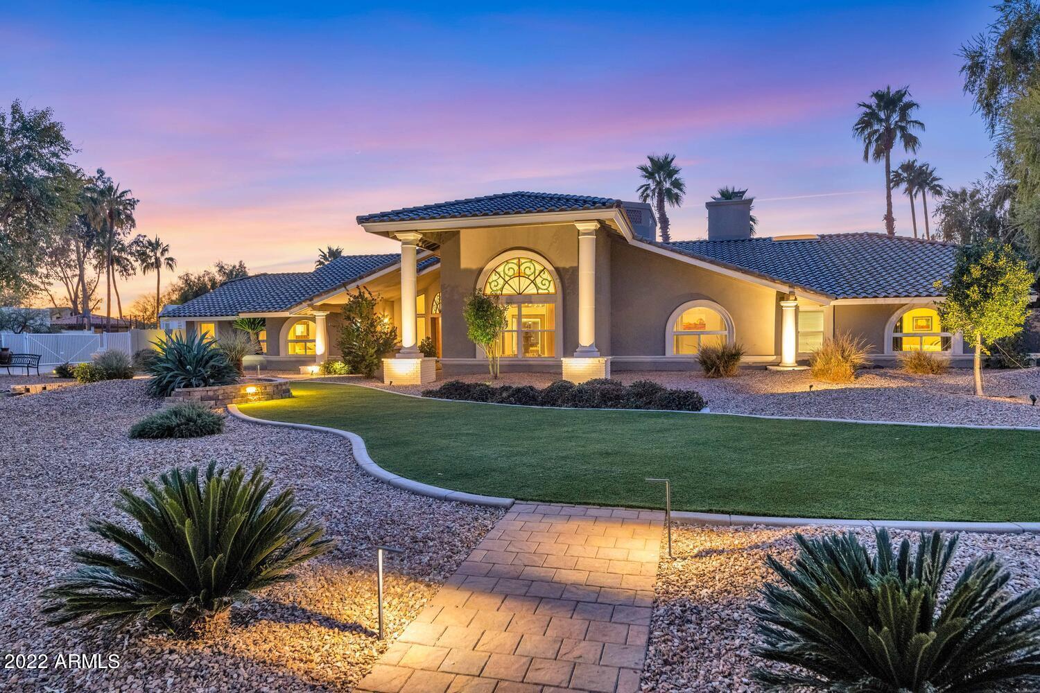 Artistic, unique and full of character - this spectacular house is a 10+! Finally, a home that doesn't look like all of the rest using the same remodeling recipe. This home exudes style with high-end custom wall finishes, interesting designer light fixtures, beautiful flooring, etc ... all in a floor plan that is made to enjoy the wonderful indoor/outdoor living in Arizona! You will love the flow of the home circling the center atrium. That interior outdoor space is perfect for relaxing or entertaining while enjoying the soothing sounds of water from the fountain and our spectacular weather. Retractable awnings allow it to be shaded when preferred. The contemporary eat-in kitchen features plenty of gorgeous cabinetry, chic backsplash, silestone counters and a large waterfall island with .. barstool seating. The bar/serving area includes beverage refrigerator and sink. The chef in you will enjoy the 5 burner induction cooktop, wall oven, microwave and warming drawer. The oversized refrigerator/freezer are deeper than the typical built-in and the chest freezer in the large walk-in pantry conveys too!  The kitchen overlooks and opens up to the expansive covered patio with multi-stack slider doors. You will love how this allows that great indoor/outdoor living and entertaining! The family room features handsome wood floors, designer wall finish and lighting, soaring vaulted ceilings, views to the atrium and an expansive wood-burning fireplace. Great atmosphere to host in the formal dining room with the stunning wood wall finish, designer lighting and views to the atrium. You will fall in love with owner's suite - it is a true escape! The spacious bedroom shares a two-way wood-burning fireplace with a sitting room and wait until you see the bathroom! This spa-like retreat features a huge open shower with multiple heads, a free standing tub, a long vanity with dual vessel sinks plus designer finishes that make the room extra special - metallic accent wall feature, chandelier over the tub, and a wall fire box, etc. The two separate walk-in closets are literally straight out of a magazine! Both custom-designed closets were featured in a brochure and are spectacular. Huge laundry room with tons of storage - washer/dryer included. Two of the spacious secondary bedrooms are in one wing - both with custom designed reach-in closets and brand new carpet. A full bathroom with split twin trough sink vanities is situated in the hall between them. The 4th bedroom with its hip ensuite bathroom is situated on the opposite end of the home making it a perfect guest or teen suite. The super-sized bonus room will make game day top notch at your home! Plenty of room for family fun and entertaining friends. Cork flooring, a custom built barn door, built-in media wall plus desk, and french door exit to long driveway behind the gate. Pool table conveys! The stylish 1/2 bathroom near the kitchen and bonus room is also perfect as a pool bath with patio access out that hall. The resort style backyard has it all! Oversized covered patio with new ceiling fans. Gorgeous stone patio surface and pool surround plus elevated sun deck with scupper water features pouring into the large saltwater dive pool. Lit sports court to play pickle ball, basketball, etc. There's a perfect spot for roasting s'mores or enjoying drinks with friends around a fire pit. Completely private backyard on this .81 acre lot! RV gate and plenty of space for parking it or trailers, etc. NO HOA. Long driveway into gated area with a side-entry detached 3 car garage. The garage has 100% UV protected poly aspartic epoxy. The single car bay has a very large full length storage closet along one wall. The double car bay has wall mounted, full backed cabinets with a lifetime warranty. Two large work benches. LOTS of storage. BRAND NEW ROOF ($70K in 2/2022) by Lyons Roofing with full warranty. Many other recent upgrades: 4 ton 18 SEER heat pump on the bedroom side of the home (7/2017),  16 SEER heat pump other side of home (2012), whole home water softener, variable speed pool pump, salt chlorinator replaced 5/2018, 2 new water heaters (2020, 2021), most windows are dual pane installed 2008 with transferable warranty, new retractable atrium awnings (Sunbrella fabric 2015) have wind sensors to close automatically to prevent damage, travertine plank flooring throughout a lot of the home, full kitchen and bathroom remodels over recent years with the most recent being the 1/2 bath in 2022, and more! The pool table, dining room table, and piano convey at no cost. In boundaries for some of the BEST schools in the highly desired Paradise Valley School district. Nestled in a quiet location in an internal exclusive neighborhood of Sunrise Estates. Close to great shopping, restaurants, entertainment, etc at Kierland and Scottsdale Quarter. Convenient to Scottsdale Airpark, Costco, Home Depot, freeway access, plus recreation, parks, bike trails, hiking, and everything that makes living in Scottsdale wonderful! Most furnishings would be available by separate bill of sale. Tour today and you will want to call this house home!