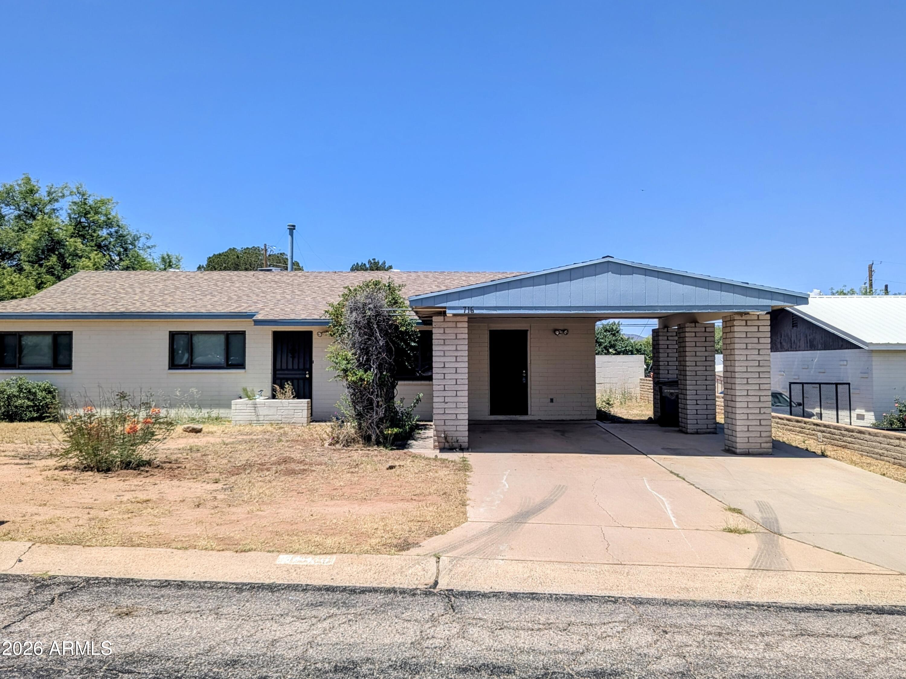 3 Bedroom, 2 Bathroom home offering 2,083 sq ft of living space and endless potential. Features include: a spacious bonus room with a wood-burning fireplace, ideal for a family room, game room, or home office. The home is ready for updates, making it a great opportunity for investors, DIY enthusiasts, or buyers looking to add their personal touch. Outside, you'll find a huge workshop with a roll-up door and rear access, perfect for hobbyists, mechanics, or additional workspace. Plenty of room for projects, storage, and customization. Don't miss this value-packed property with space, flexibility, and opportunity!