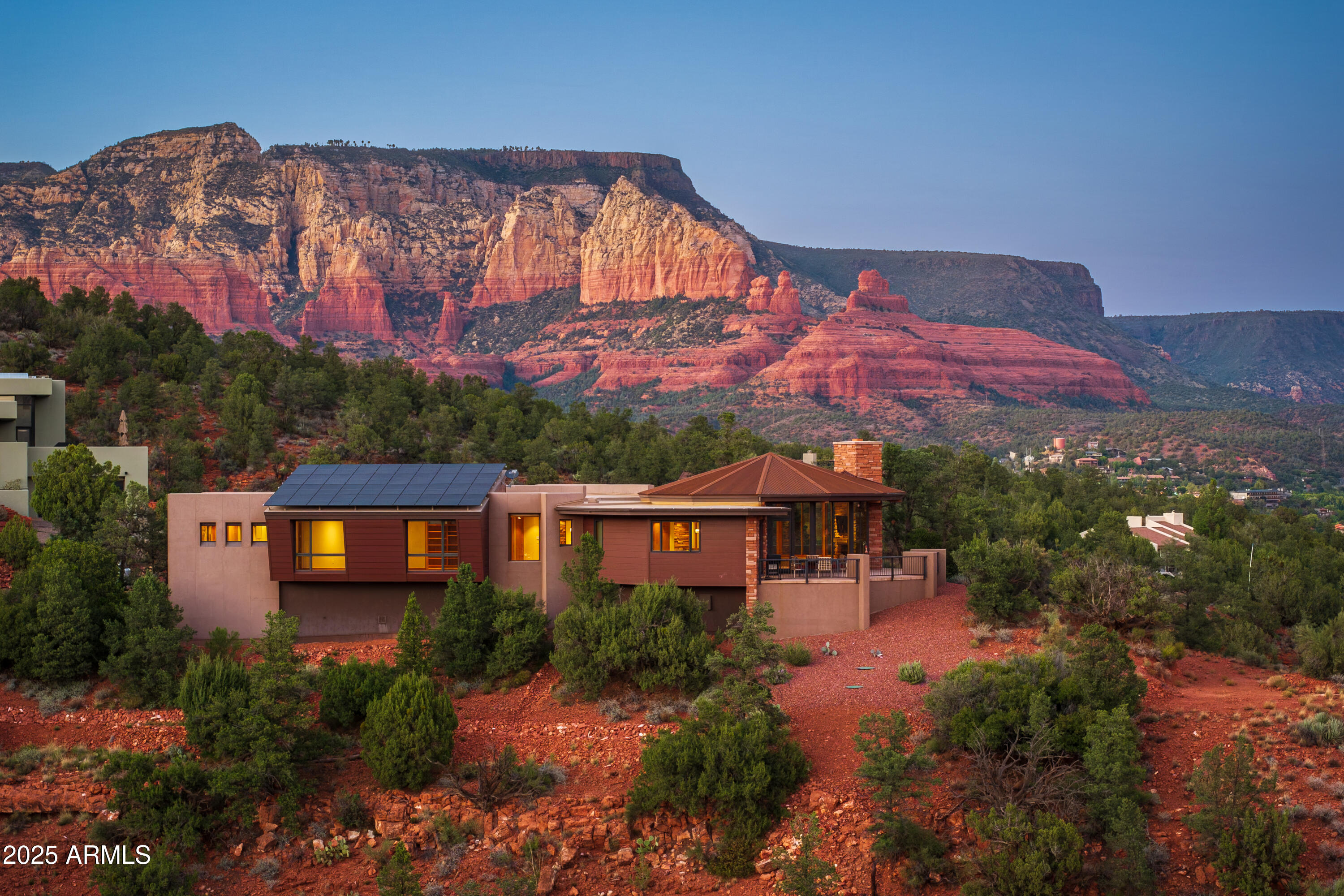 Don't let this dream slip away...grab your chance to own a jaw-dropping 2022 masterpiece by the legendary Design Group, brought to life by Sedona's acclaimed builder, Joel DeTar! Perched like royalty on a 1.29-acre hilltop throne with only 3 other homes, this masterpiece delivers nearly 360-degree epic RED ROCK views that'll steal your breath and your heart. This is your ticket to Sedona's ultimate ''pinch-me'' lifestyle! This home flaunts panoramic vistas from a wraparound deck, perfect for sunset sips or morning coffee with the Red Rocks. Lock in those views forever with the adjacent .87-acre lot (offered separately with buyer's first right of refusal). This 3,466 sq ft single-level, nearly new gem offers cutting-edge design, modern efficiency, and views that scream ''you've arrived''! LOT INCLUDED IN SALES PRICE (VALUE: $150,000). 

Don't Miss The 3-D Tour & Floor Plan Available! Photos with furniture are virtually staged with furniture.

Luxury That Wows: With 3 bedrooms, 3.5 bathrooms, this home is designed to impress. Revel in radiant in-floor heating, a stained glass overlay on the primary bedroom's door, and slick electric blinds throughout.

Gourmet Kitchen Goals: Cook like a pro with a Sub-Zero refrigerator, wine refrigerator (yours with the sale!), ultra-quiet Bosch dishwasher, electric cooktop and stove, and instant hot water for those cozy Sedona nights.

Eco-Smart & Wallet-Friendly: Rock owned solar panels on a slanted roof for major savings, plus an owned propane tank. Charge your EV with ease using the 50-amp service in the garage (charging station not included).

Pure Bliss Amenities: Dive into relaxation with the above-ground swim spa and sleep soundly knowing the fire suppression system in has your back. 

Your Hilltop Kingdom Awaits: With only 4 homes on this exclusive hilltop, you'll feel like Sedona royalty. Deed restrictions (no short-term rentals, 30-day minimum) keep the peace. Check MLS documents for details. Forget outdated remodels with aging roofs and appliances; this nearly new gem offers cutting-edge design and modern efficiency, at an unmatched price.

820 Laurel Spur isn't just a dream, it's your Sedona fairytale come true. Don't wait to claim your crown and live the dream!

Details:
- Wraparound view deck
- Sub-Zero, Bosch & wine refrigerator
- Den/optional 4th bedroom
- Owned propane tank
- Instant hot water
- 50 AMP EV garage outlet
- Electric blinds
- Above-ground swim spa
- Adjacent .87-acre lot may be purchased separately (Parcel:401-56-021). Buyer has first right of refusal to purchase adjacent lot
- Unmatched privacy, stunning sunsets, and just minutes from West Sedona

960 Laurel Spur (Adjacent Lot): Parcel - 401-56-021 (Lot 23) shall be sold with property on separate purchase contract - with first right of refusal to buyer. Seller paid $350,000 for lot. Offer of consideration on price of lot shall be determined with the purchase of residence (Lot 24: 820 Laurel Spur).