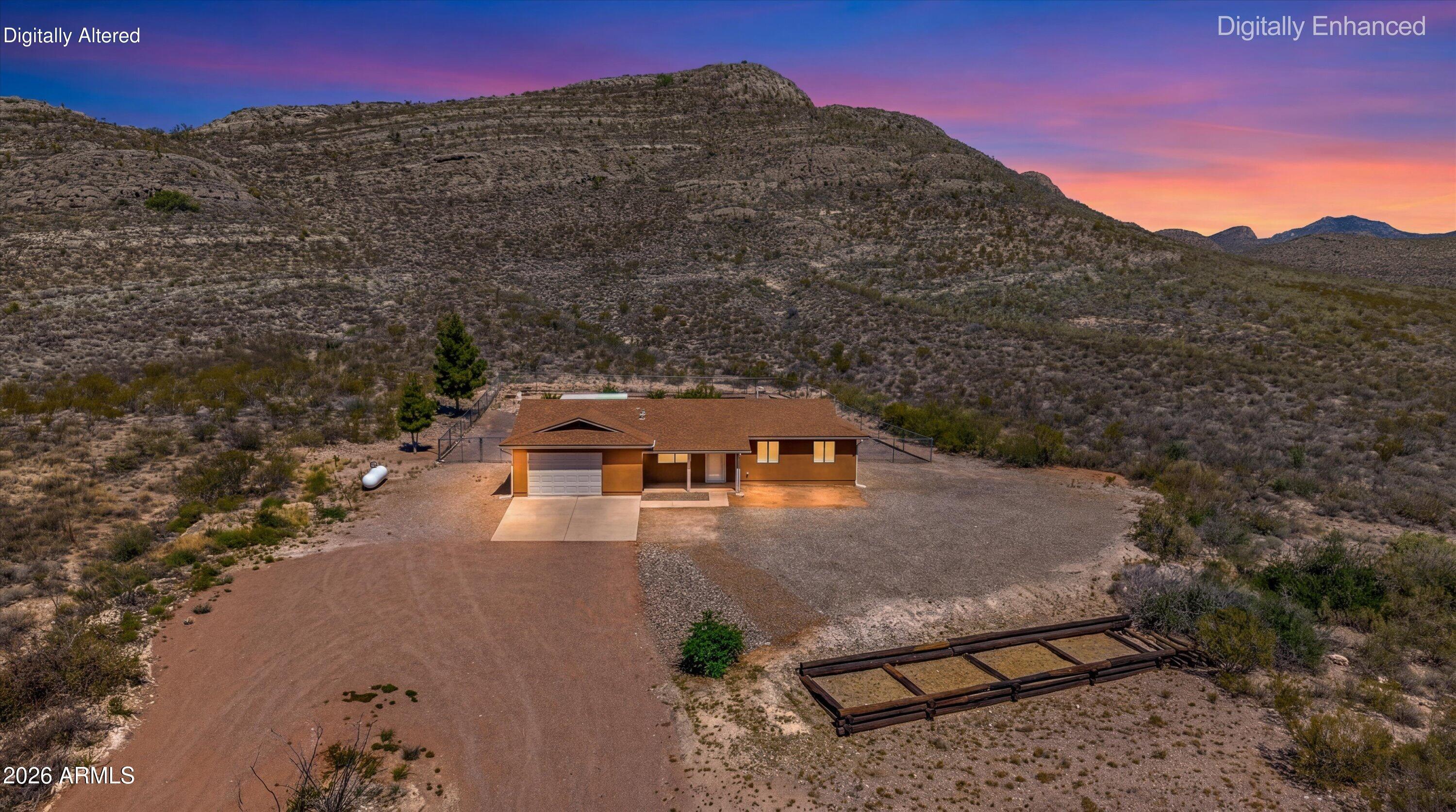 Welcome to your fully renovated mountain retreat! Located at 2251 N Spanish Trail, this 3-bed, 2-bath single-level home sits on 4+ acres with breathtaking valley views. Experience unparalleled privacy with undeveloped land on three sides and a mountain in your backyard.

Inside, the home has been completely transformed. The master suite features backyard access, a luxurious soaking tub, and separate shower. The kitchen includes a convenient desk area.

Outside, discover a private haven with planting structures, and an extended 2-car garage perfect for a workshop. With a reshingled roof, new insulation, and modern upgrades throughout this 1,309 sq. ft. home, it's completely move-in ready. Don't miss this unbeatable location for quiet, private living!