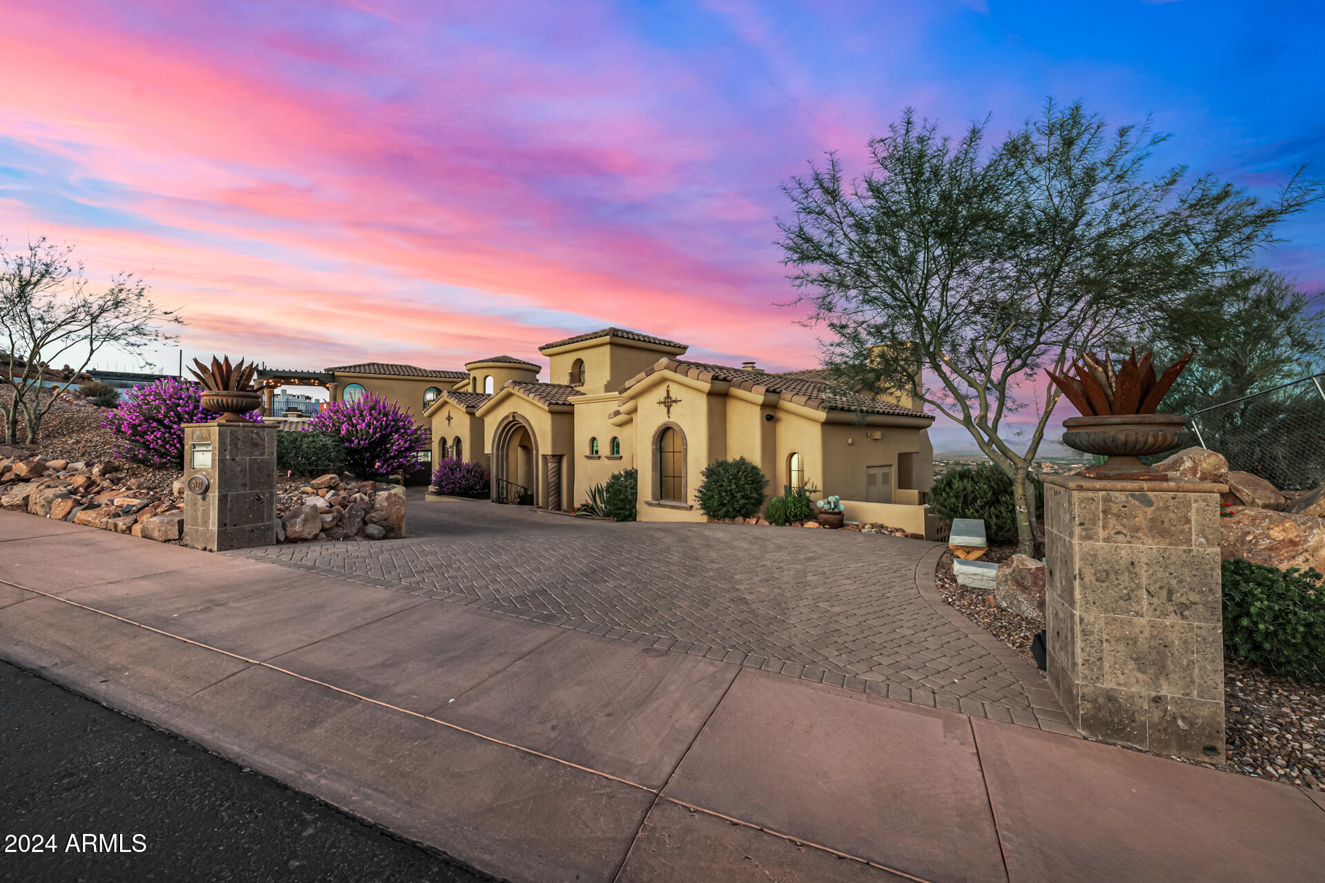 Experience Unparalleled Mountain views and Luxury living
Nestled at an exclusive hilltop location, this 1.66 acre gated estate offers breathtaking
desert landscapes, set at an elevation of almost 2000 feet. Enjoy panoramic views of
city lights and Arizona's most iconic mountains, including four peaks, Red Mountain,
and camelback, from every room of this meticulously crafted 5 bedrooms, 6.5 bath
home.
Designed for those who cherish natural beauty and modern convenience, this home
boasts an open floor plan that fills each space with light. The seamless flow between
the gourmet kitchen, expansive living areas and covered outdoor patios makes it an
entertainer's dream.
Step outside and be transported to a private oasis, complete with a sparkling saltwater
pool, a new Sundance Optima spa and built in BBQ area. Thoughtfully landscaped for
both beauty and ease, the backyard provides lush and low maintenance greenery and
unparalleled views of the golf course and surrounding mountains.
Key features
· Majestic mountain views from every window
· Resort style backyard with saltwater pool, spa and BBQ area.
· Spacious and bright open floor plan
· Prime location on one of Firerock's most coveted streets
· Close to luxury amenities and Arizona's fines outdoor recreation
Discover a true Arizona gem where every detail has been crafted to offer elegance,
comfort and awe-inspiring scenery.