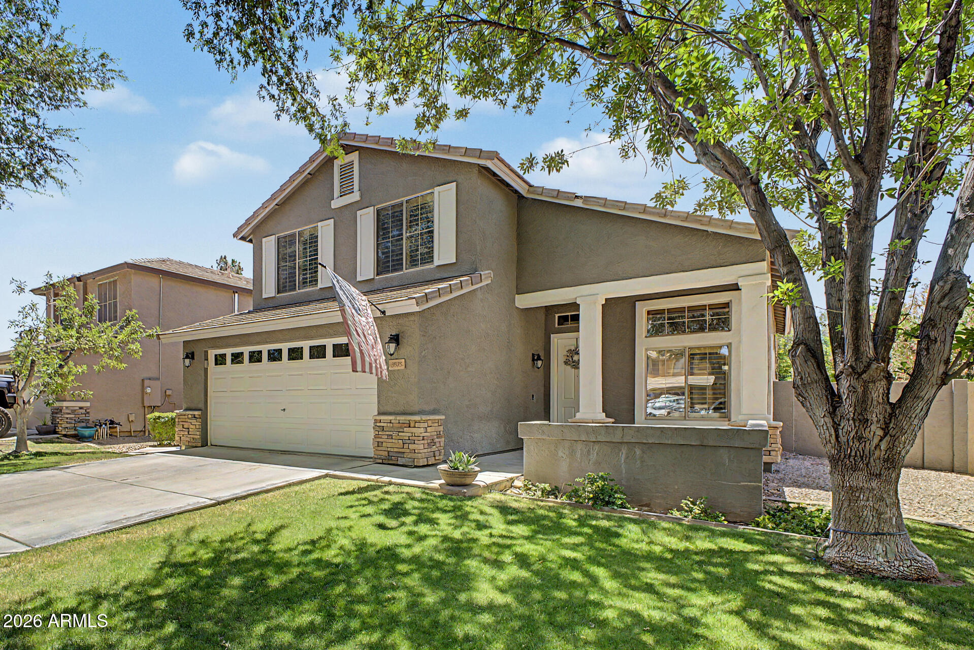 Welcome to the highly sought-after Higley Groves at Morrison Ranch, where tree-lined streets, charming white picket fences, and a lush mature canopy create a cooler, inviting neighborhood atmosphere year-round. This stunning two-story home offers exceptional curb appeal, mature landscaping, a sparkling saltwater pool, and a spacious 2-car garage.
Inside, you'll find 3 bedrooms plus a versatile den, 3 bathrooms, and beautifully designed living spaces perfect for both everyday living and entertaining. The home features a formal living and dining room with soaring vaulted ceilings, along with a warm and welcoming family room that opens to the kitchen.

Designed with gatherings in mind, the kitchen showcases a large granite island, ample workspace, and an open-concept layout ideal for hosting family and friends. Upstairs, the spacious primary suite provides a relaxing retreat with an en suite bath featuring dual sinks, a separate soaking tub and shower, and a generous walk-in closet.

Located within an A-rated school district, this home combines comfort, style, and community charm in one of the area's most desirable neighborhoods.