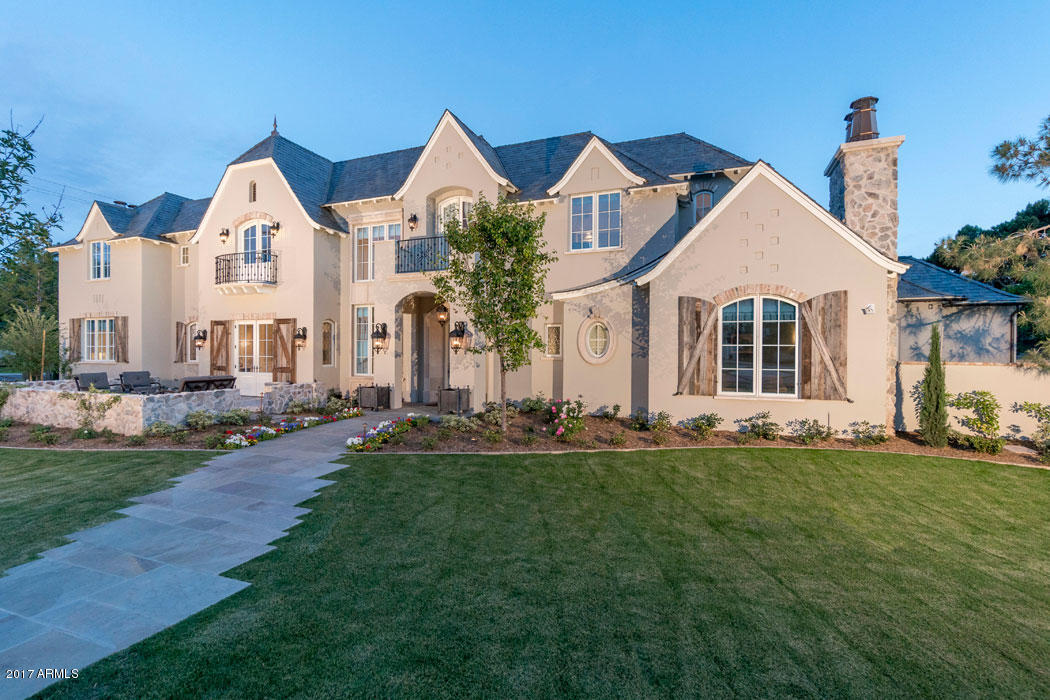Major price reduction on this gorgeous 2015 build! Gorgeous home features 5 bedrooms and 6 bathrooms. Wide plank solid wood flooring, custom cabinetry doors and windows; quartz counter tops; beautiful hand-made tiles; reclaimed beams…so many sought-after designer details. Open floor plan with a fabulous great room featuring telescoping doors opening to a heated patio creating the ultimate year round indoor/outdoor entertaining space. Kitchen has every desired appliance and a beautiful walnut topped island perfect for family dining. Master wing features a lovely den/office and a serene separate bedroom. Upstairs is accessed via the staircase or wood-paneled elevator. The Berghoff  yard is gorgeous and the barn designed for guest stays and ultimate entertaining is one of a kind.