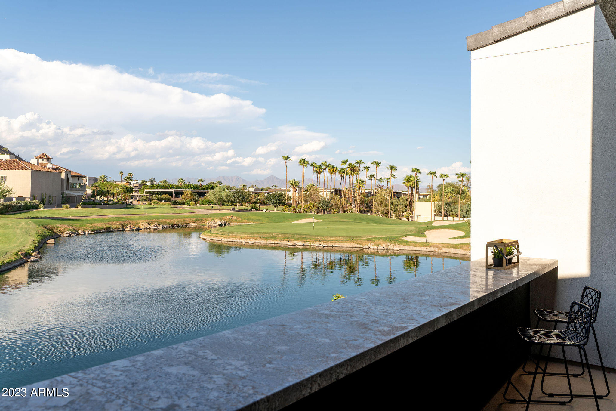 This is the OPPORTUNITY you've been waiting for! The RARE CHANCE to not only own in the latest PREMIER LUXURY community at THE PHOENICIAN, but to also own on arguably the highest PRIZED LOT LOCATION! Unobstructed views of the ICONIC CAMELBACK MOUNTAIN, extended views to the MCDOWELL MOUNTAINS and TOM'S THUMB, as well as a PICTURESQUE VIEW and clear line of sight to the 18TH GREEN. No expense was spared in completing this home and has everything one would expect to find in a property of this caliber. THERMADOR appliances, MOTORIZED ROLL DOWN SHADES, an ELEVATOR, full wall SLIDING GLASS PANELS, Savant HOME AUTOMATION, and an AUDIO/VIDEO package to die for with ALL 8 SONY FLAT SCREENS INCLUDED! This community is sold out and ALL WARRANTIES TRANSFER!