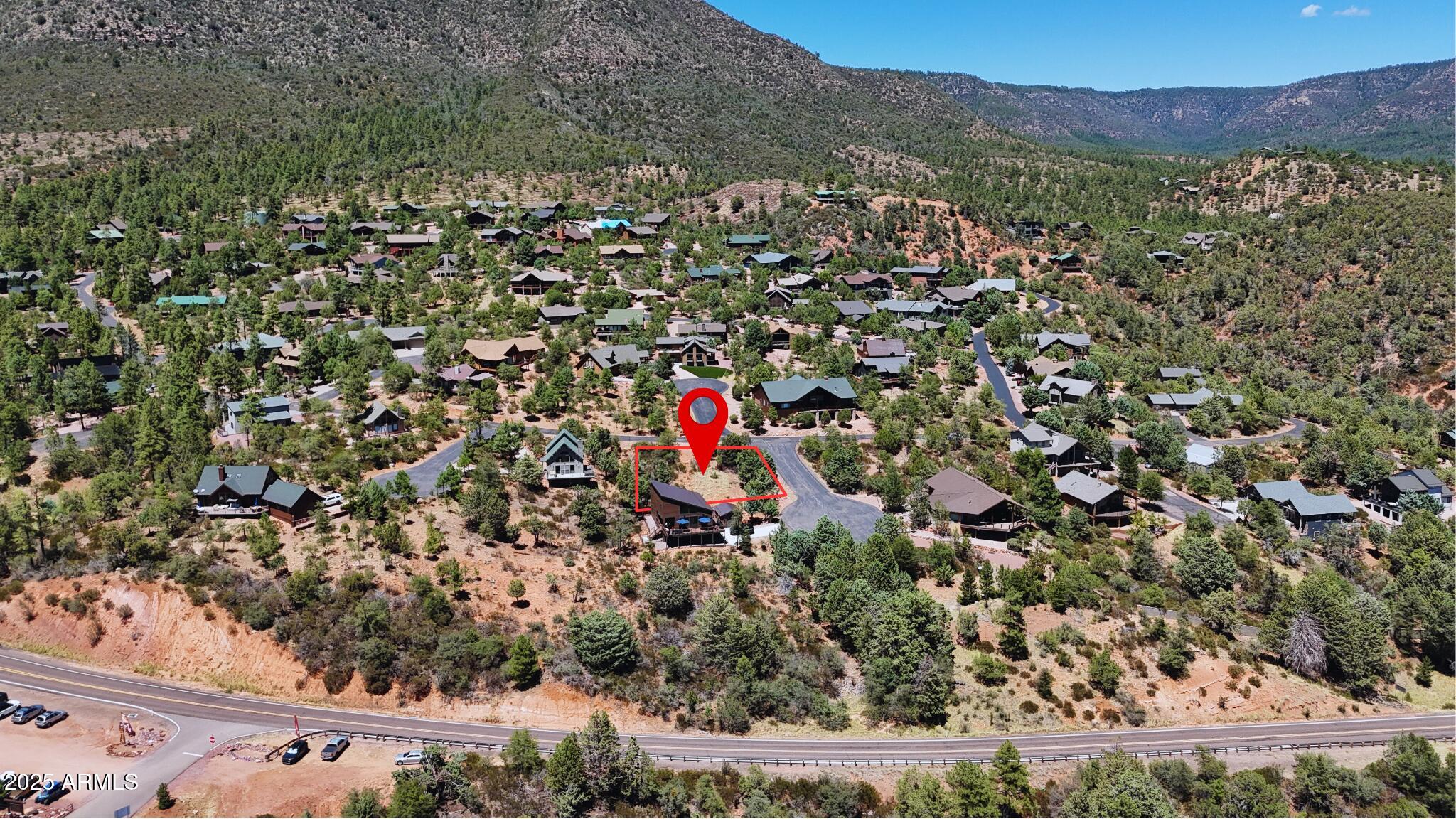 Build your dream mountain home in Pine's premier gated community, Portal IV. This .23-acre lot is beautiful, buildable, and ready to go with all utilities already ran (water, sewer, electric). Surrounded by stunning custom homes, mature pines, and abundant wildlife, this homesite offers breathtaking mountain views, paved access, and peace of mind. Enjoy cool temps, elk sightings, and endless nearby outdoor recreation—just minutes from hiking, dining, and small-town charm. A rare opportunity to own in one of Northern Arizona's most exclusive neighborhoods.
