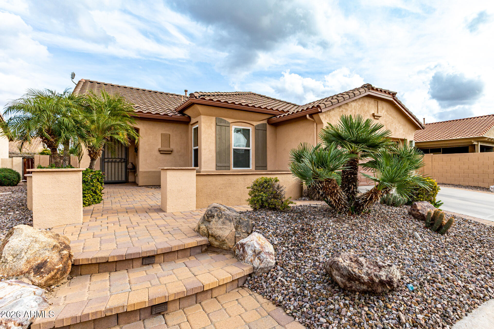 One of a kind in Robson Ranch—featuring a rare detached casita in the backyard! From the moment you arrive, you'll appreciate the inviting brick paver front courtyard and freshly painted exterior. This home is pristine inside and out. The main home offers a 2-bdrm, 2-bath split floor plan with granite countertops, stainless appliances (2019),large pantry, entry closet, hall linen closet, and walk-in closets in both bedrooms. Primary suite includes a walk-in shower and dual vanities. The back of the home is filled with windows overlooking a beautifully designed backyard with a large covered patio, gas BBQ, water fountain, and desert landscaping with a touch of artificial turf. This space flows seamlessly to the stand-alone casita (built 2011)with all-tile flooring, walk-in shower, closet, large flex/storage area ideal for a future kitchenette, new AC (2023), and water heater (2020). So many thoughtful featuressee document tab for details.

Main home sq ft 1355 casita 390