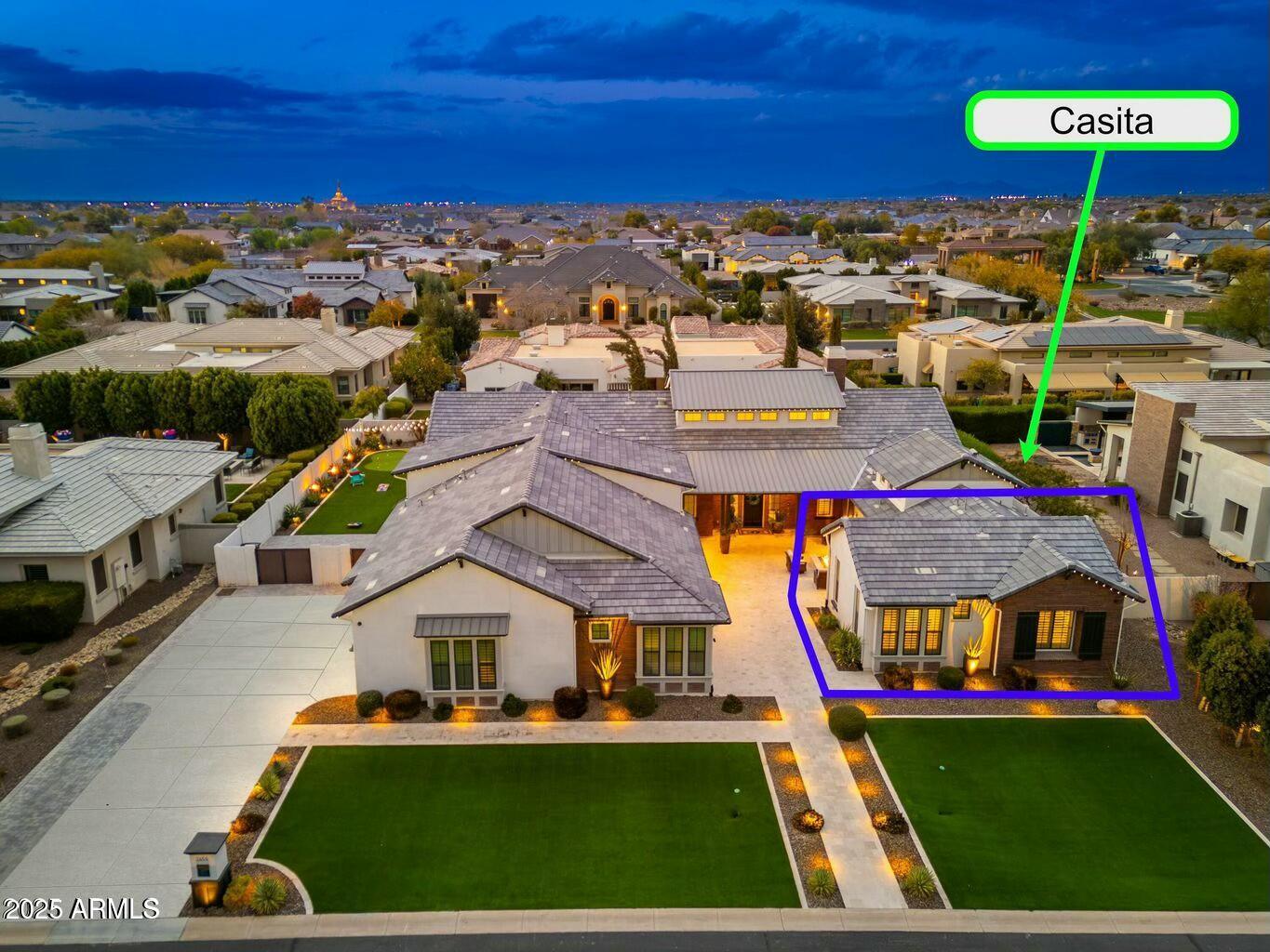 Excellence in prestigious Whitewing at Germann Estates! BASEMENT & CASITA!  Can be purchased w/ most furniture. Luxury meets security in this exclusive Guard Gated Entrance! Elegant iron gates This one-of-a-kind 6,975 sq. ft. dream home, built by Toll Brothers, offers an exceptional blend of elegance, comfort, luxury & ultimate in entertainment. Courtyard entry welcomes you to this amazing 6 Bedrooms,(ALL ENSUITE)  6.5 Bathrooms Estate with a spacious 1,922 sq ft Basement! PLUS guest/ multi-gen Casita=separate entrance, and 4 Car Garage! Grand living & dining room with soaring 20ft ceilings, 3 sleek tiled electric color-changing fireplaces, 16ft wall of glass, and wet bar/ smoothie station. Kitchen is a true Chef's delight-Wolf 60''dual gas range AND double ovens below, steam oven Subzero 36'' Sub Zero Refrigerator and Freezer, plus 30" wine re-fridge w/ pull out beverage drawers, two center islands, HUGE pantry and coffee bar/niche. Gorgeous staggered Alder cabinets with glass front on upper cabinets light. Quartz countertops and Carrera marble herringbone back-splash. Family room boasts custom media wall w/ hidden storage cabinets and 100" electric fireplace, and 16ft disappearing wall of glass. 1200sq. ft. Owner's suite features double-door entry, dual closets, walk-out to private patio, remote window shades,  spacious ensuite with16 ft. ceilings, soaking tub, separate shower and dual vanities. Beautifully designed office features a hidden bookcase door and custom built-in cabinetry and desk, offering a unique and private workspace. The Basement is an entertainer's dream, theater area, game area, custom wet bar, gorgeous granite and cabinetry, full refrigerator, and extensive cabinetry for display, Separate work-out room- Also downstairs are two additional bedrooms and two bathrooms, making it a perfect retreat for guests or extended family. Every inch of this home showcases superior craftsmanship, custom designer additions. Casita is approximately 500 sqt ft, provides a private entrance a living area, kitchenette, bedroom and bathroom perfect for guests or multi-gen living. Incredible Backyard Paradise w/ entertainment options galore! Awesome pebble-tech salt water heated pool with water slide, grotto cave, 20 man hot tub with swim-up bar and custom fire pit, and beautiful water/fire features everywhere !!  WHAT A SUPERB HOME!!