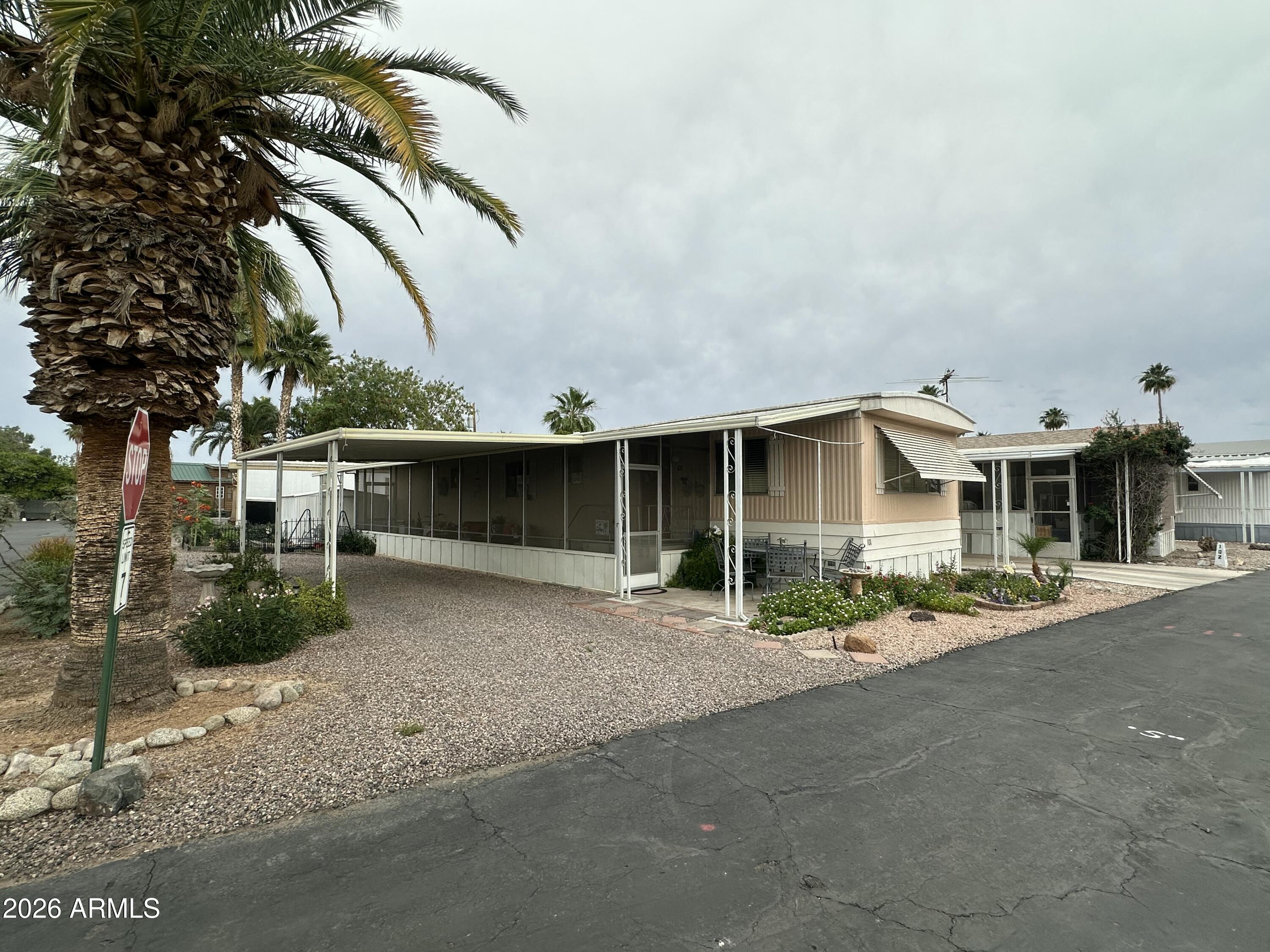Welcome home! This well-maintained 2-bedroom, 1-bath mobile home sits on a desirable corner lot with drive-through parking for ultimate convenience. Step inside to find a comfortable, move-in ready layout, then unwind on your private enclosed patio -- perfect for morning coffee or evening relaxation year-round.
Everything you need is just minutes away. Located near shopping, restaurants, grocery store and freeway access.