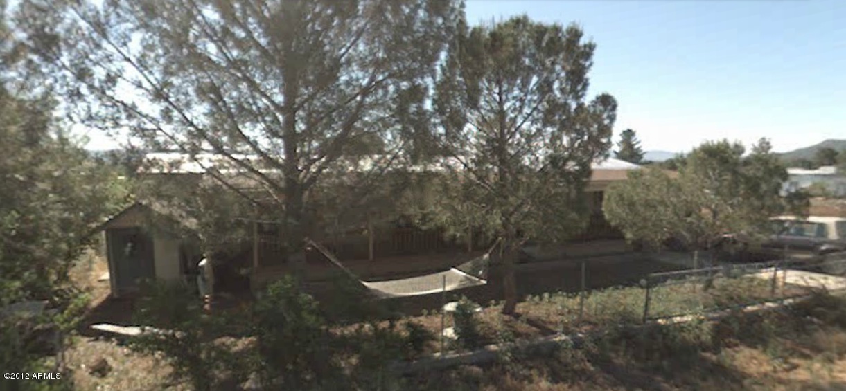 Cozy home nestled behind shady pine trees.  Covered front porch perfect for relaxation.  Freshly painted two bedrooms, two baths, living room, and den.  Open back yard, storage shed.  Nice country livin'. Ready to move in.
Seller's manager is an Arizona licensed real estate agent.