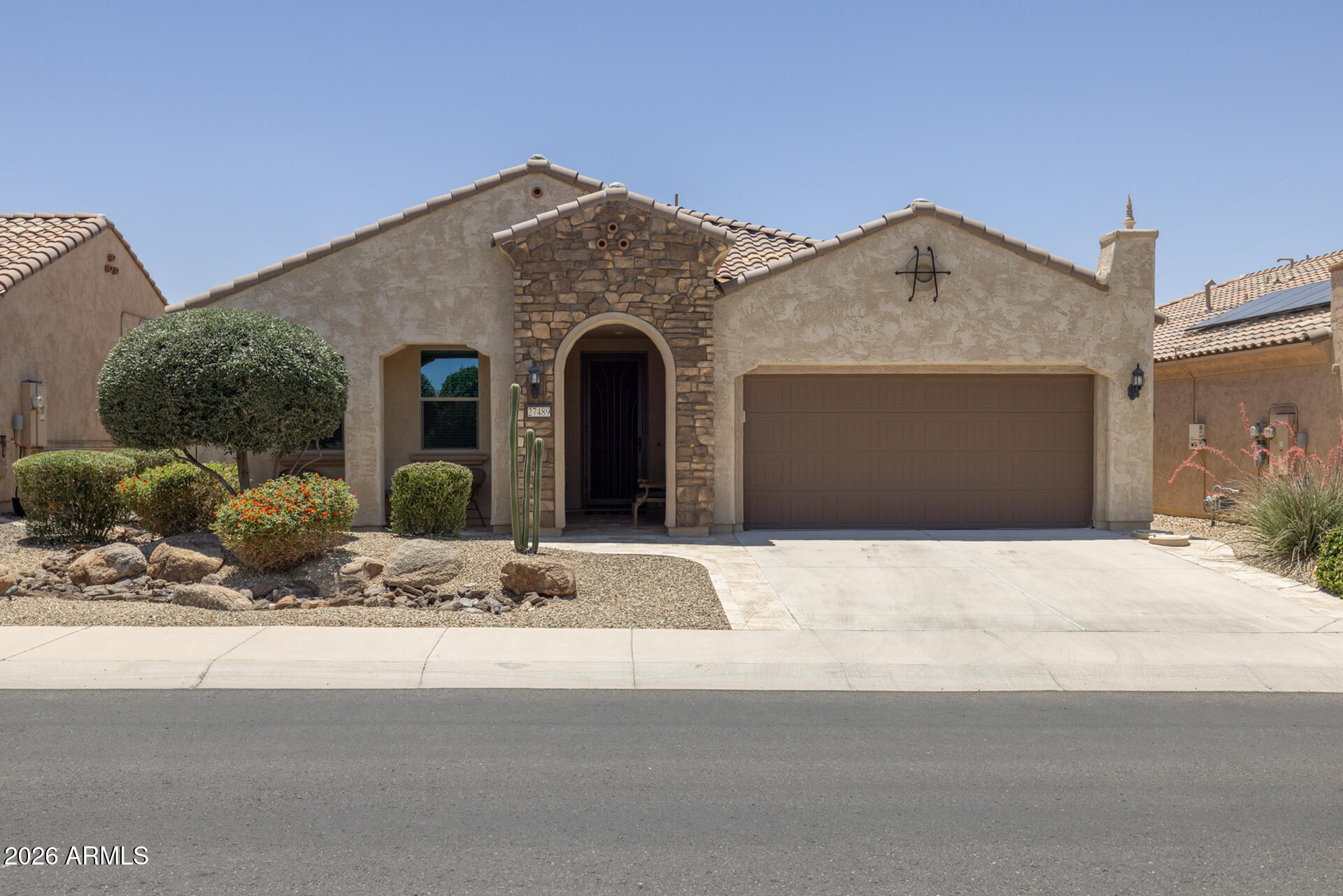 Wonderful opportunity for effortless, resort-style living in Sun City Festival! This move-in ready, fully furnished home features the popular Hideaway floor plan with 2 bedrooms and 2 baths, an open great room layout, and split bedrooms for added privacy. The upgraded kitchen offers staggered cabinets with crown molding, granite countertops, stainless appliances, a walk-in pantry, and an island with breakfast bar and pendant lighting. Sliding glass doors lead to an extended covered patio with ceiling fan and a low-maintenance desert-landscaped backyard with no rear neighbors, just a peaceful walking path behind the home. The primary suite includes an en-suite bath with double sinks, and a spacious closet. Additional features include a water softener, tankless water heater, and an oversized 2-car garage with epoxy floors and built-in cabinets, and all appliances and furnishings in the home are included. Residents enjoy exceptional community amenities at two recreation centers, including resort and lap pools, fitness centers, group fitness studios, outdoor patios, an indoor walking track, and courts for pickleball, bocce, and tennis, while golfers will appreciate the 27-hole Troon-managed course.